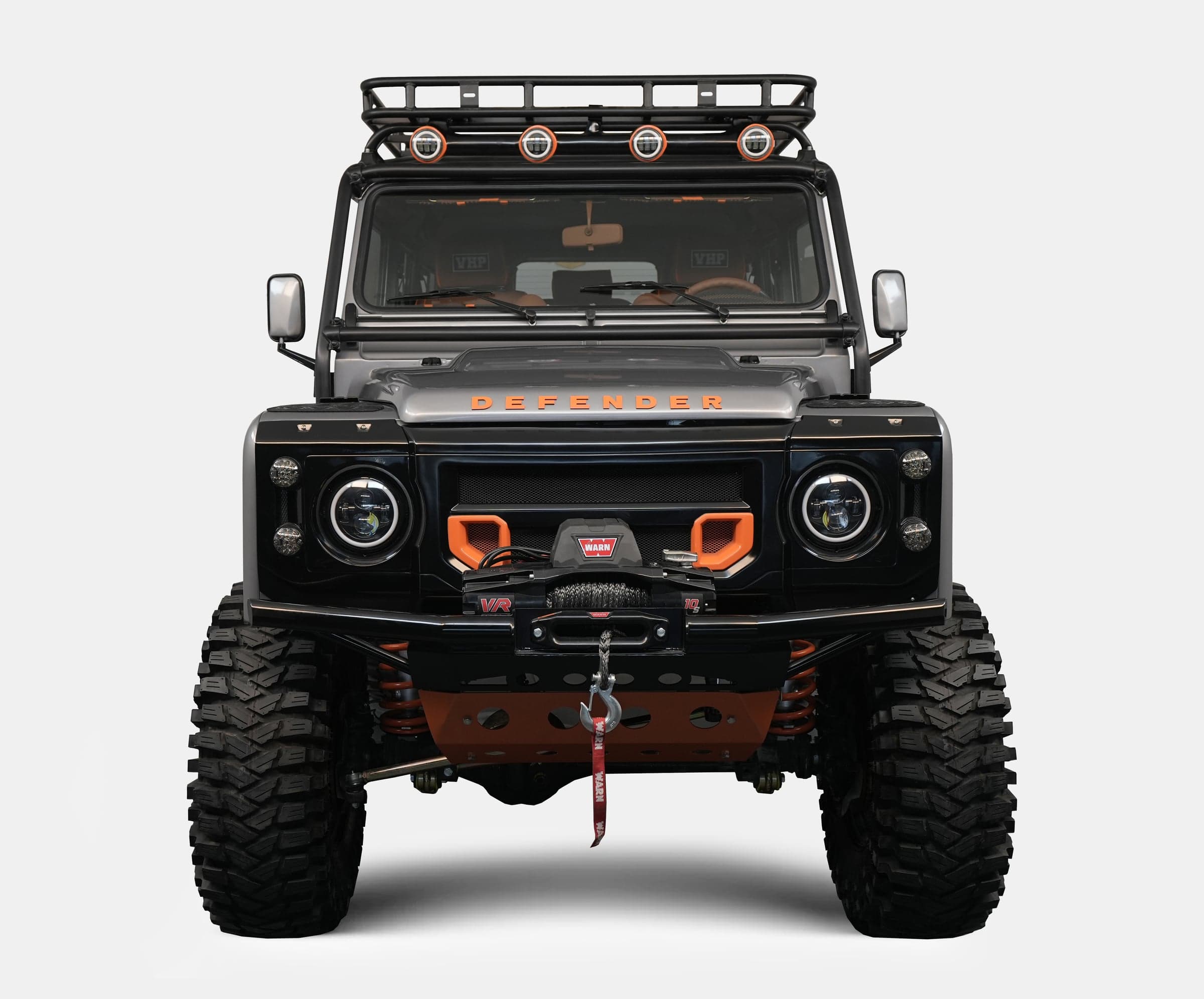 Custom Land Rover Defender with black and orange accents