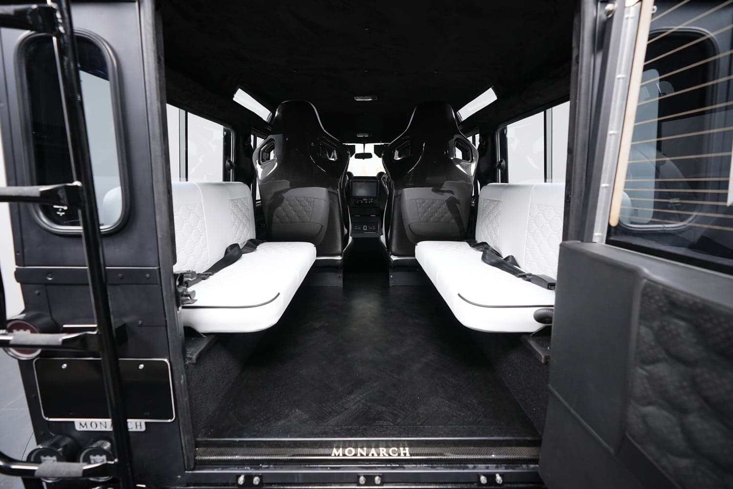 Interior Shot: Luxury Seating Interior of a custom Land Rover Defender with luxury seating