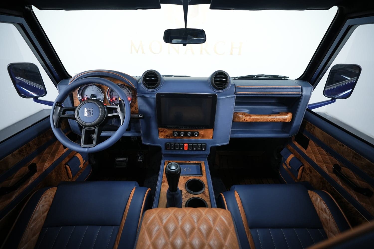 Interior Shot: Bespoke Land Rover Defender Luxurious interior of a custom Land Rover Defender with premium leather and wood accents