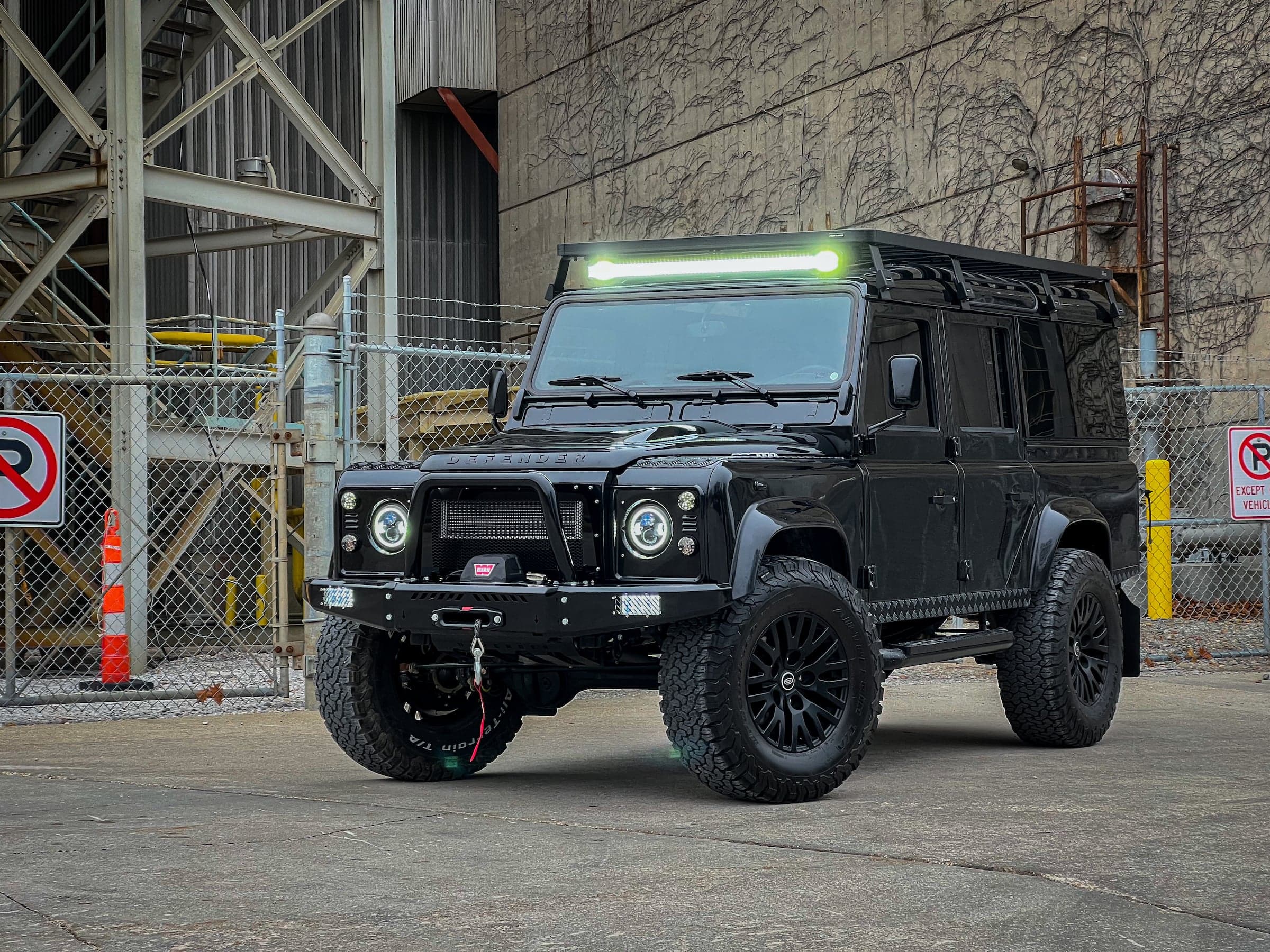 Front View: Custom Black Defender Custom black Land Rover Defender with off-road capabilities and LED light bar