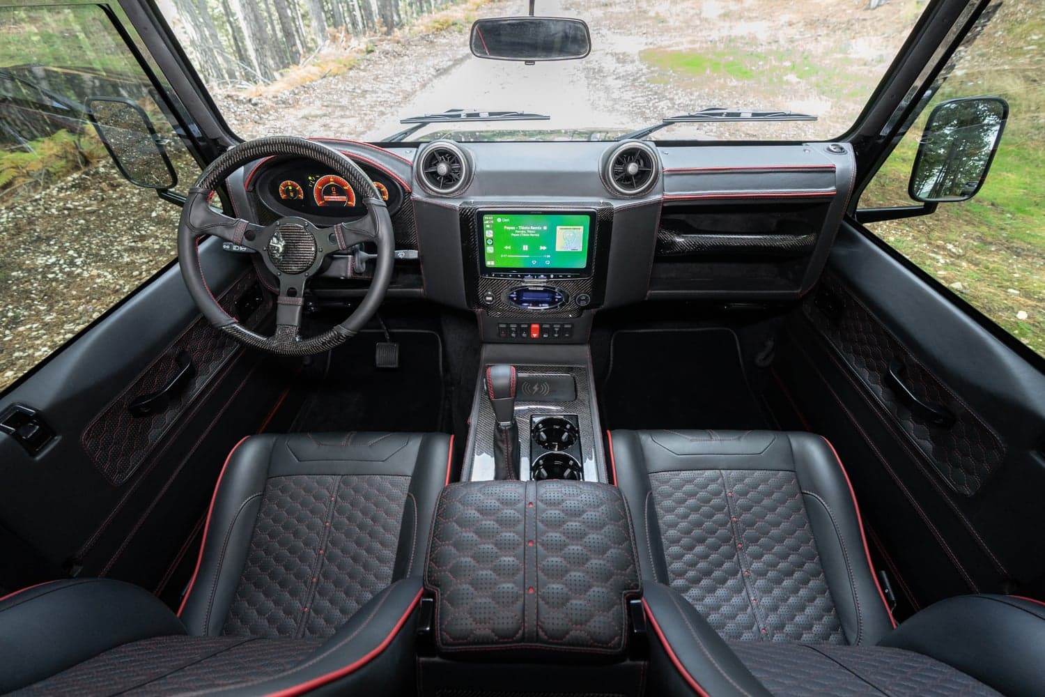 Interior Shot: Luxury Cabin Design Bespoke Land Rover Defender interior featuring premium leather seats and modern dashboard