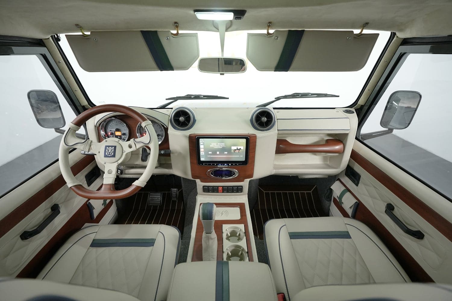 Interior Shot: Luxurious Cabin Design Bespoke Land Rover Defender interior featuring premium leather and wood accents