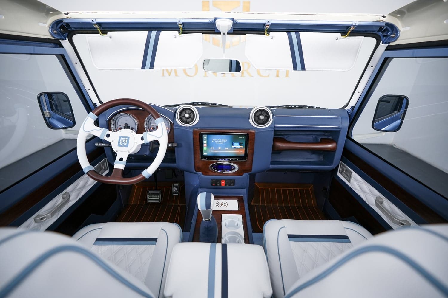 Interior Shot: Luxurious Cabin Design Luxurious interior of a custom Land Rover Defender with a panoramic view