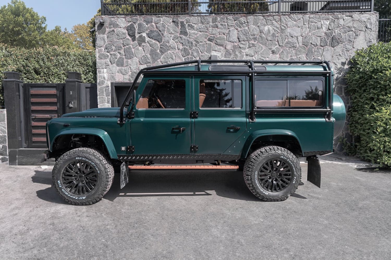 Side View: Bespoke Land Rover Defender Custom Land Rover Defender in deep green with luxury features