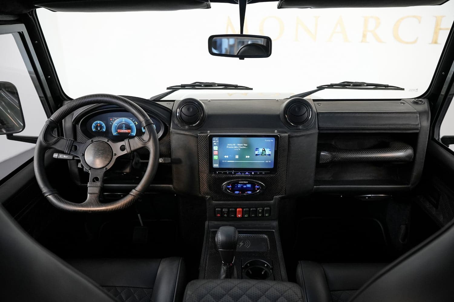 Interior Shot: Luxury Cabin Custom Land Rover Defender interior featuring a modern dashboard and premium materials