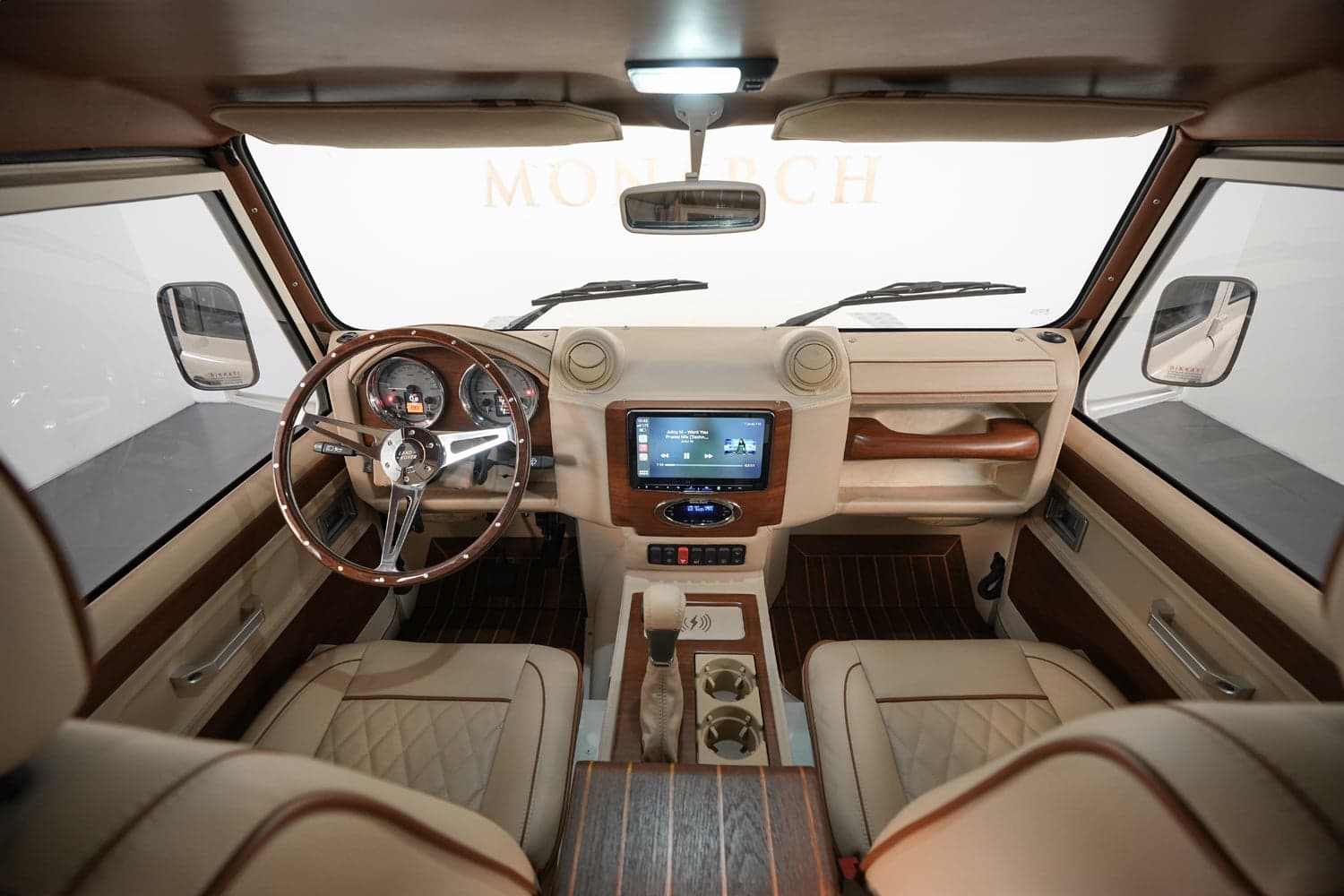 Interior Shot: Luxury Cabin Design Bespoke Land Rover Defender interior with premium materials and modern technology