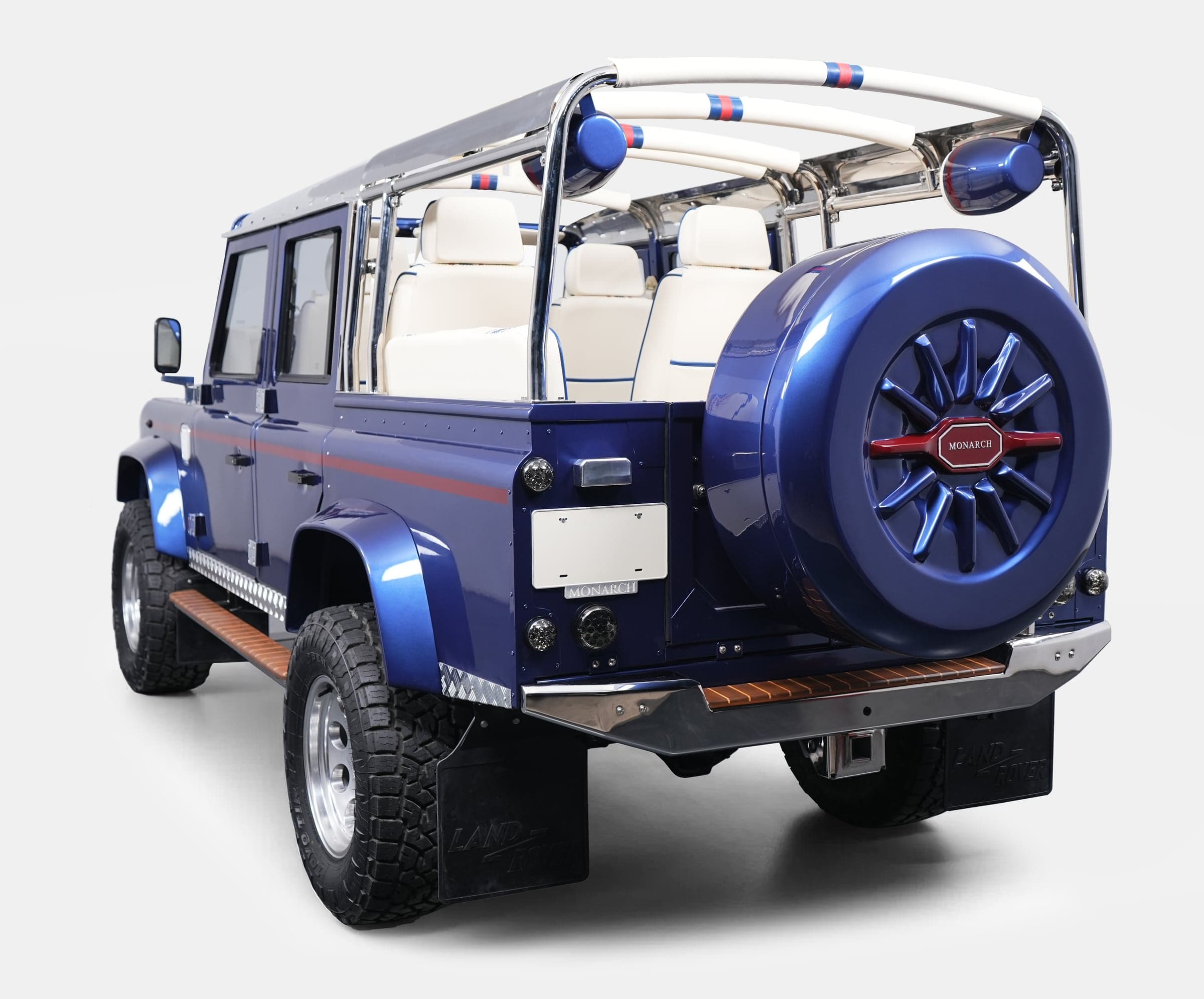 Rear View: Bespoke Land Rover Defender Custom Land Rover Defender in blue with white interior and chrome details
