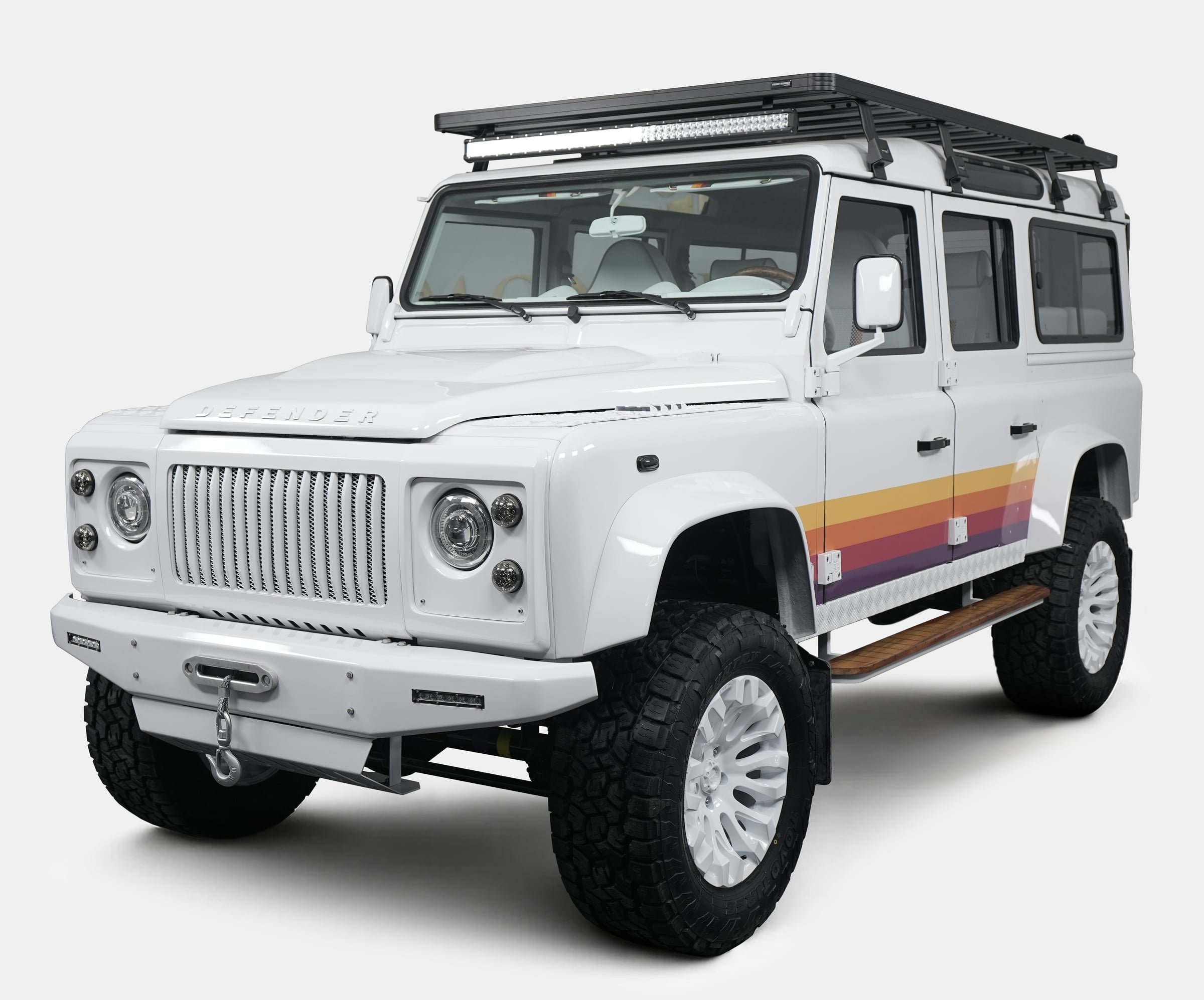 Studio Photo: Bespoke Land Rover Defender Custom Land Rover Defender in white with retro stripes and off-road tires