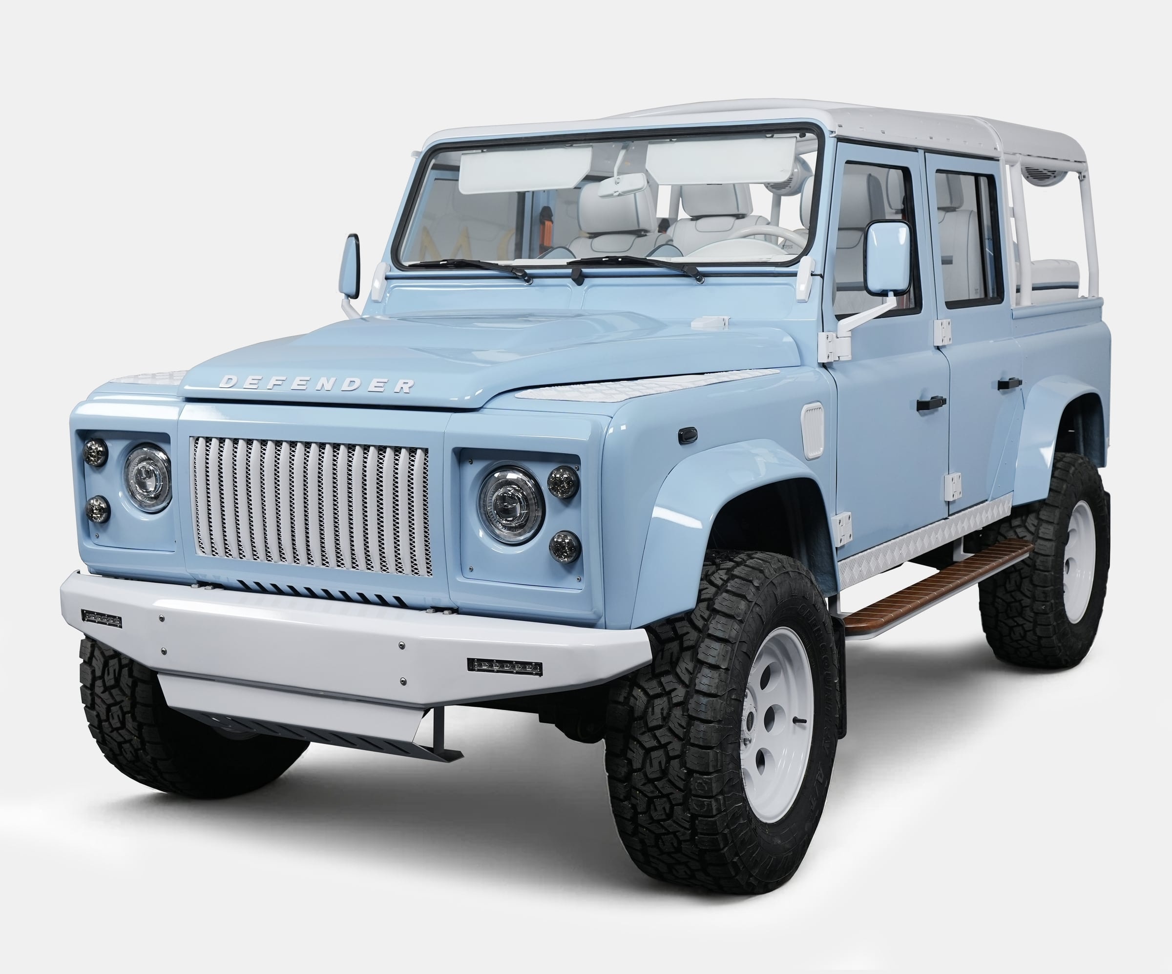 Front view of a custom light blue Land Rover Defender with a white roof Front view of a custom light blue Land Rover Defender with a white roof