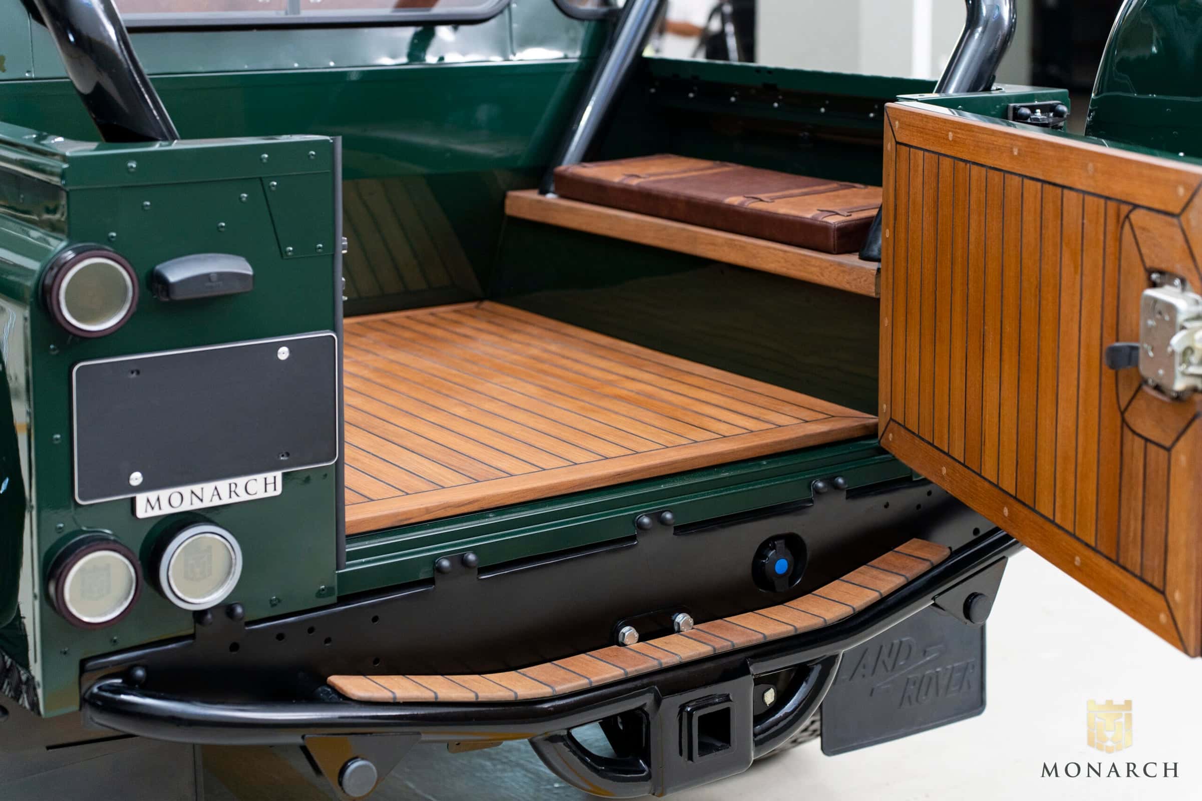 Luxury Land Rover Defender cargo area with wooden flooring and custom features