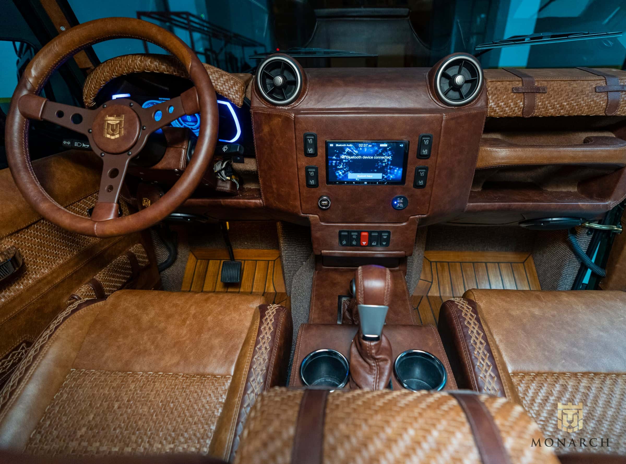 Bespoke Land Rover Defender interior with leather upholstery and modern dashboard