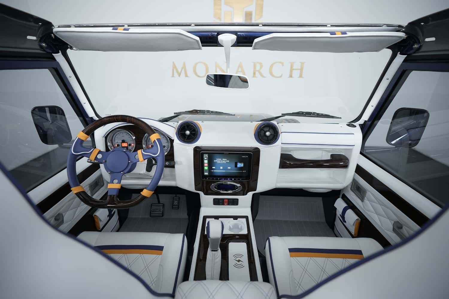 Luxurious interior of a custom Land Rover Defender featuring premium materials and modern technology