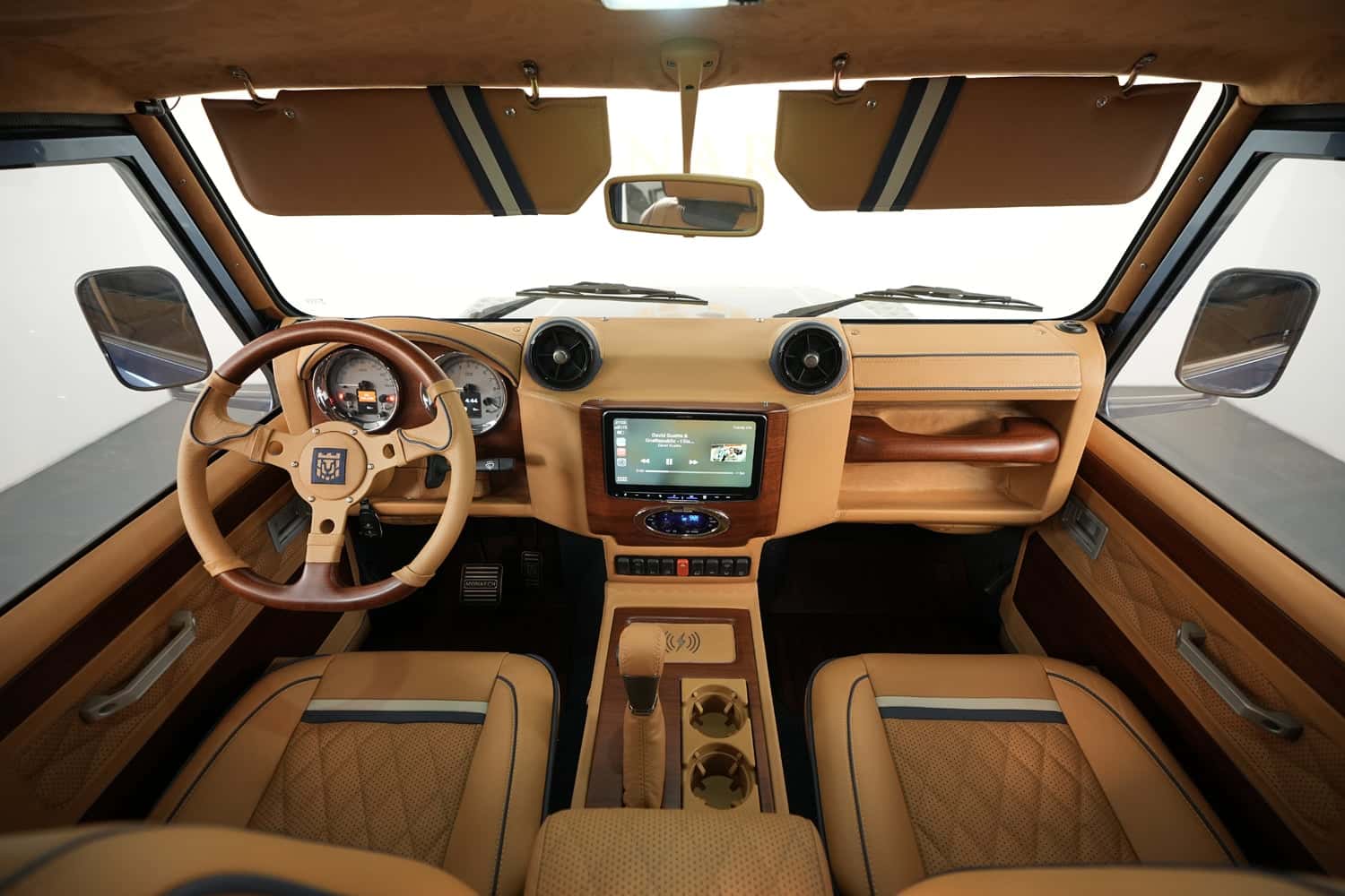 Bespoke Land Rover Defender interior featuring premium leather and wood accents