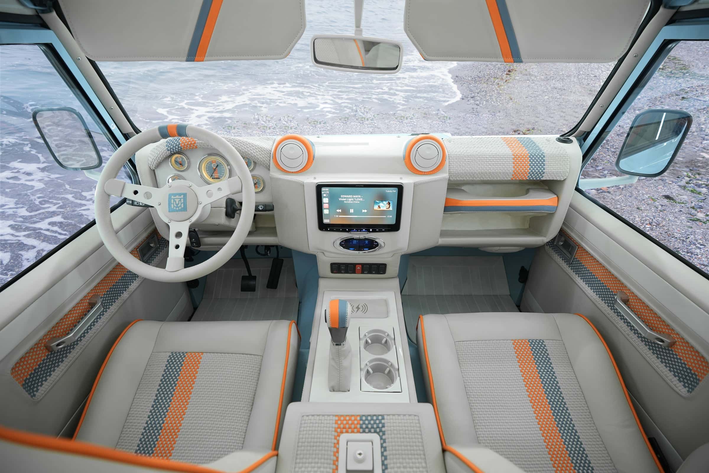 Interior view of a custom Land Rover Defender featuring modern design elements and luxury materials