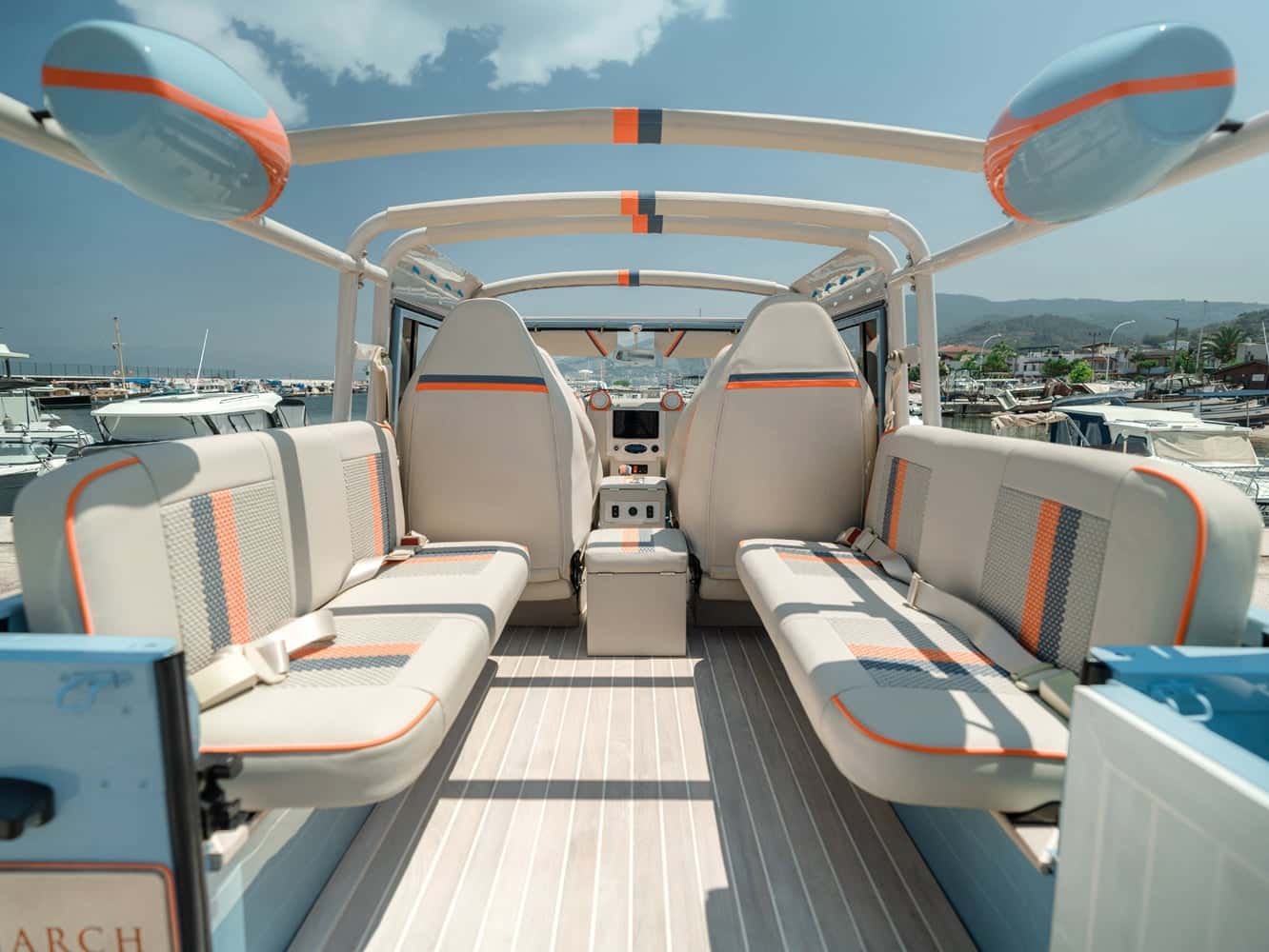 Open-air interior of a custom Land Rover Defender with luxury seating