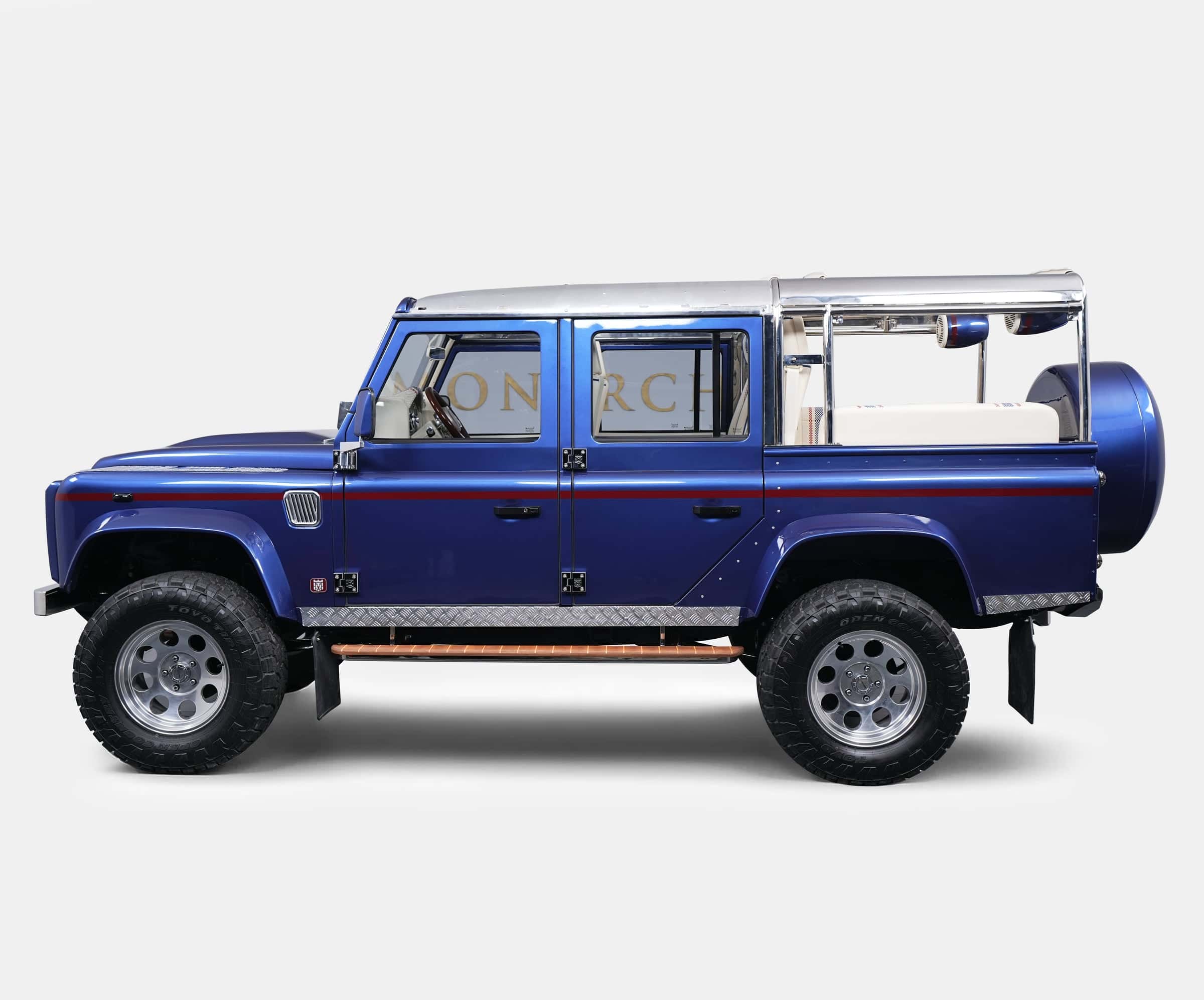 Custom Land Rover Defender in blue with chrome accents and unique design features