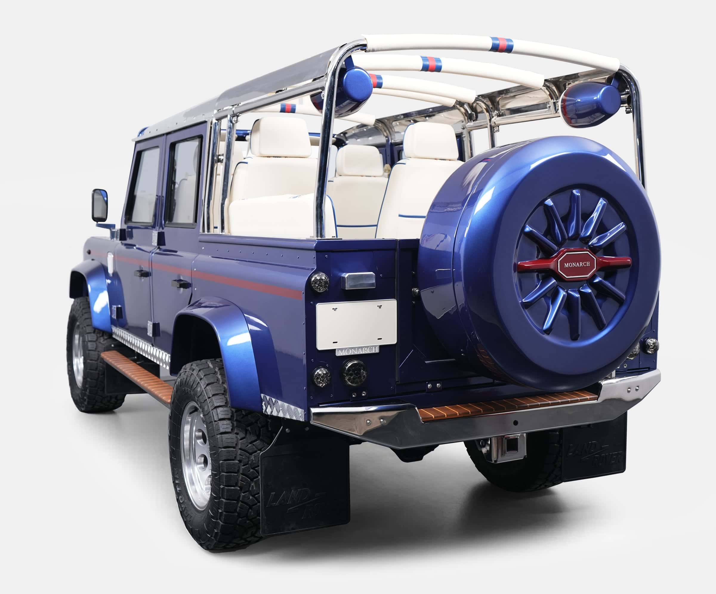 Custom Land Rover Defender in blue with white interior and chrome details