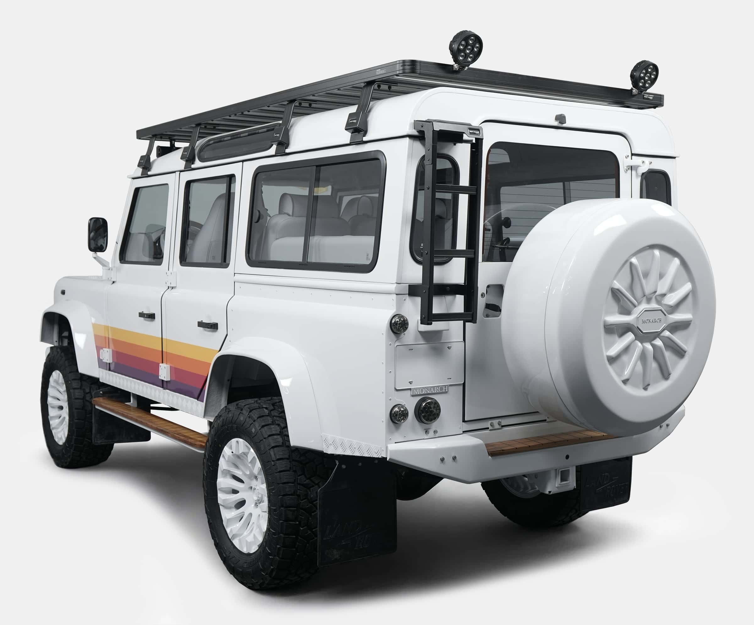 Custom Land Rover Defender with distinctive rear styling and roof rack