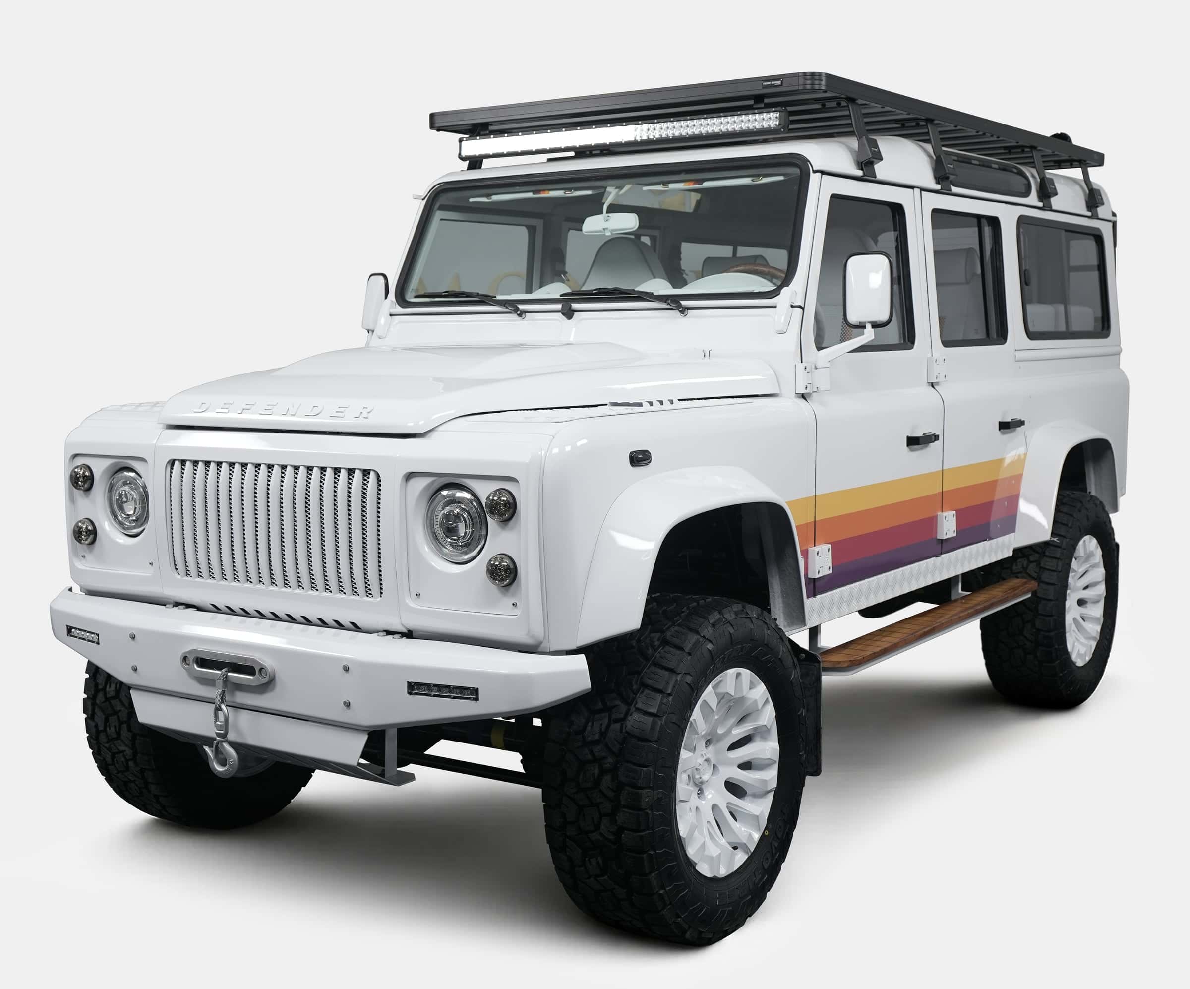 Custom Land Rover Defender in white with retro stripes and off-road tires