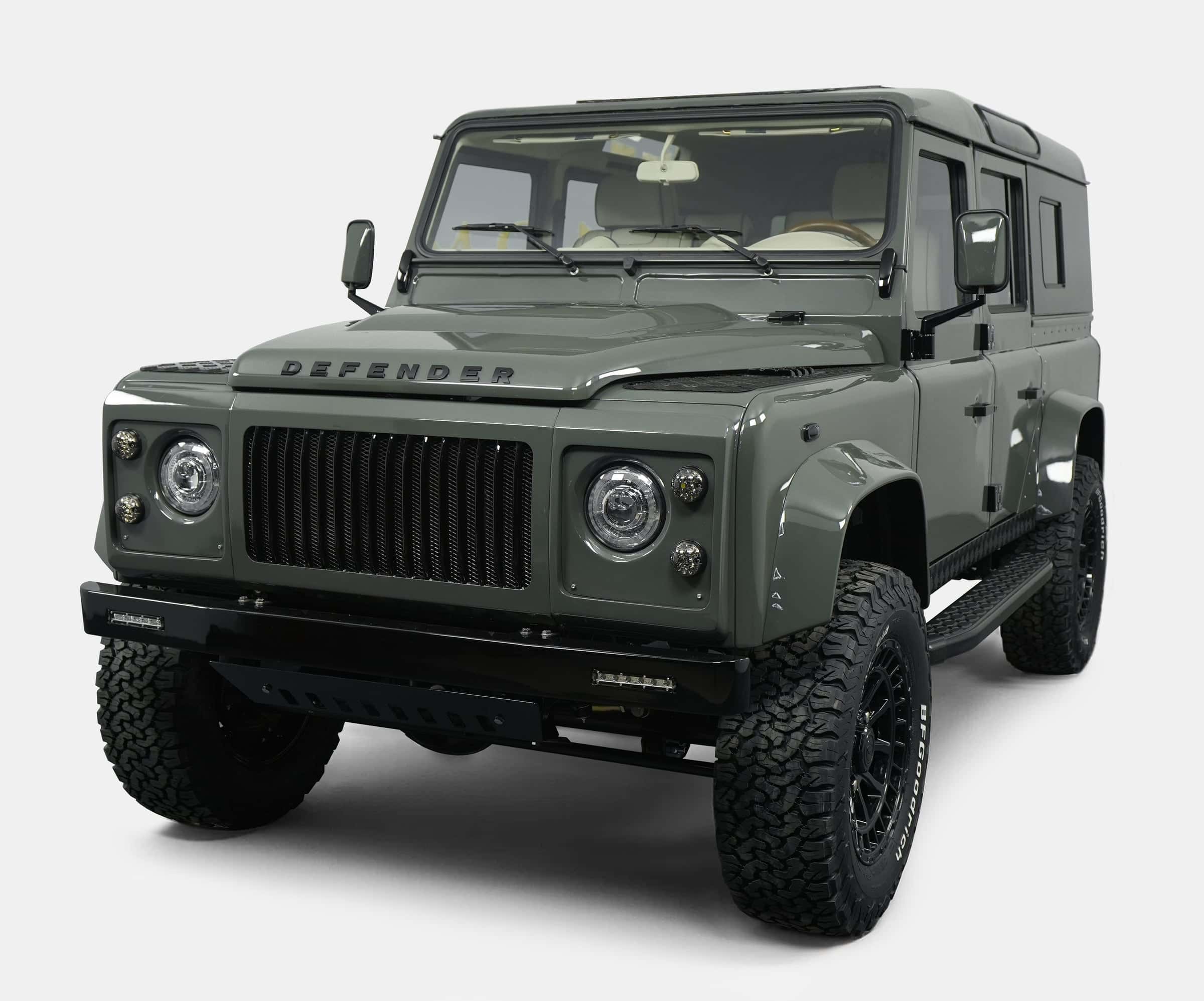 Front view of a custom Land Rover Defender in green color