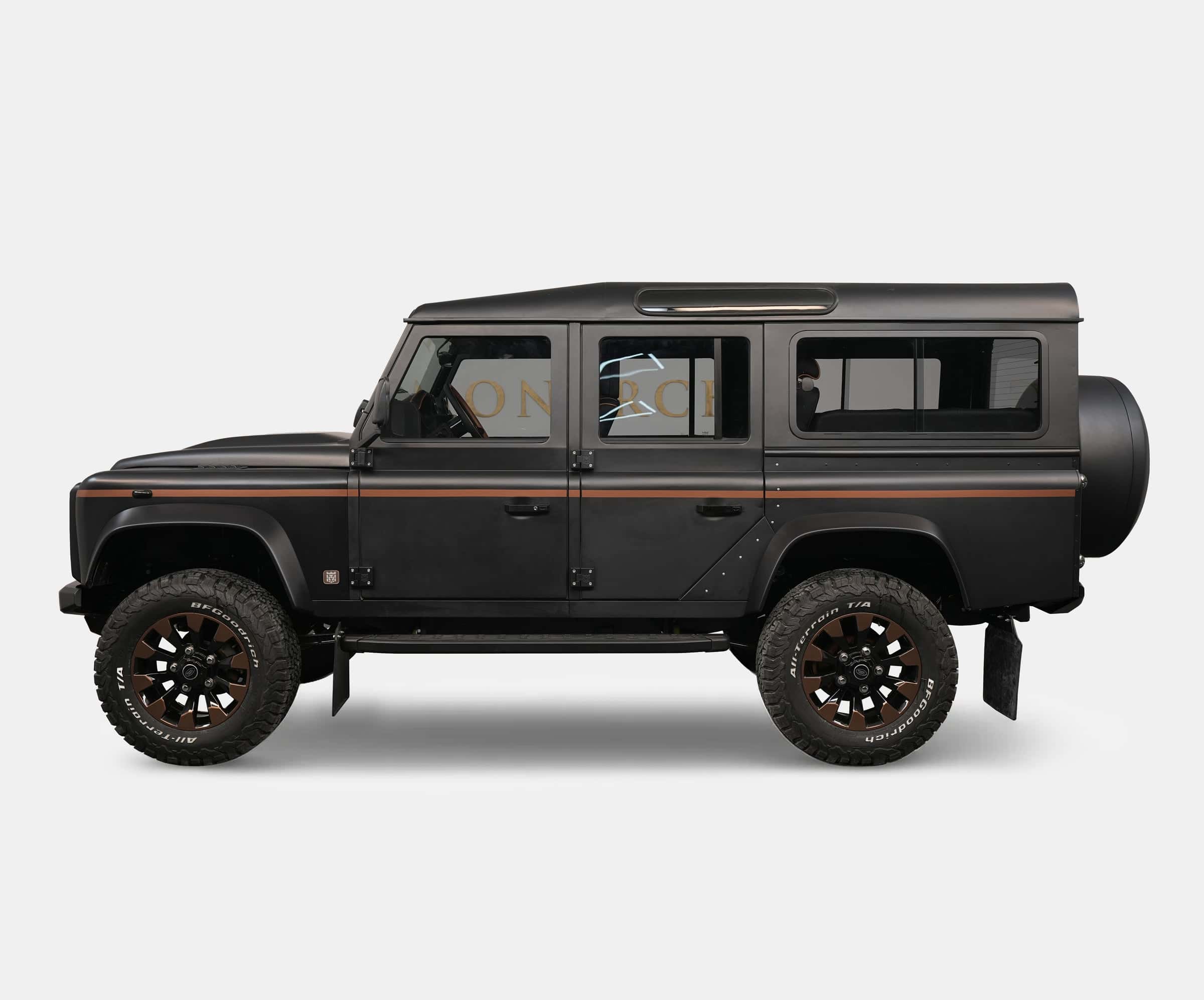 Custom Land Rover Defender in matte black with bronze wheels