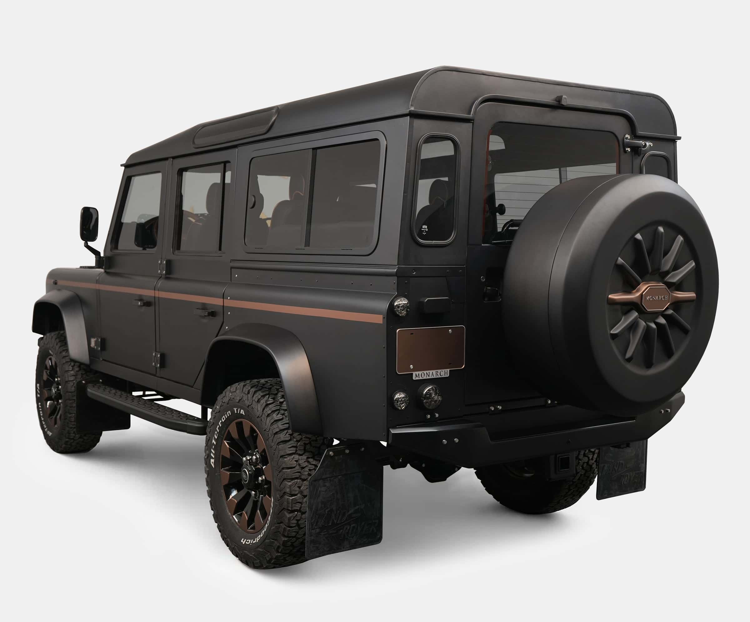 Rear view of a bespoke Land Rover Defender with a matte finish and stylish accents