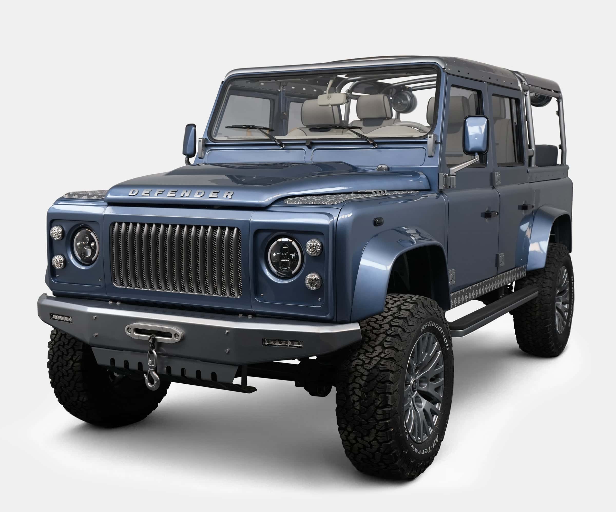Custom Land Rover Defender in blue with premium wheels and off-road tires