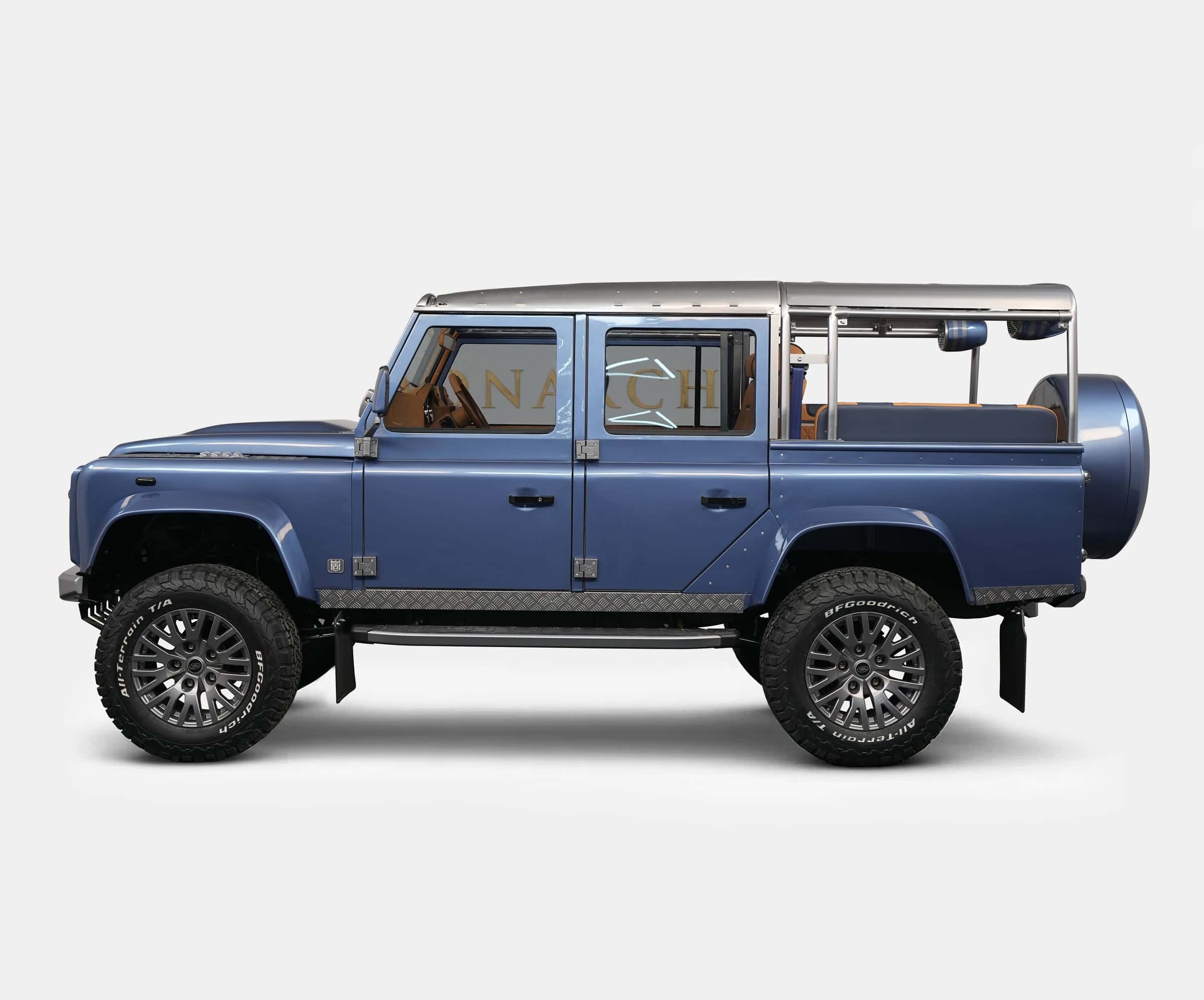 Side view of a bespoke blue Land Rover Defender with luxury modifications