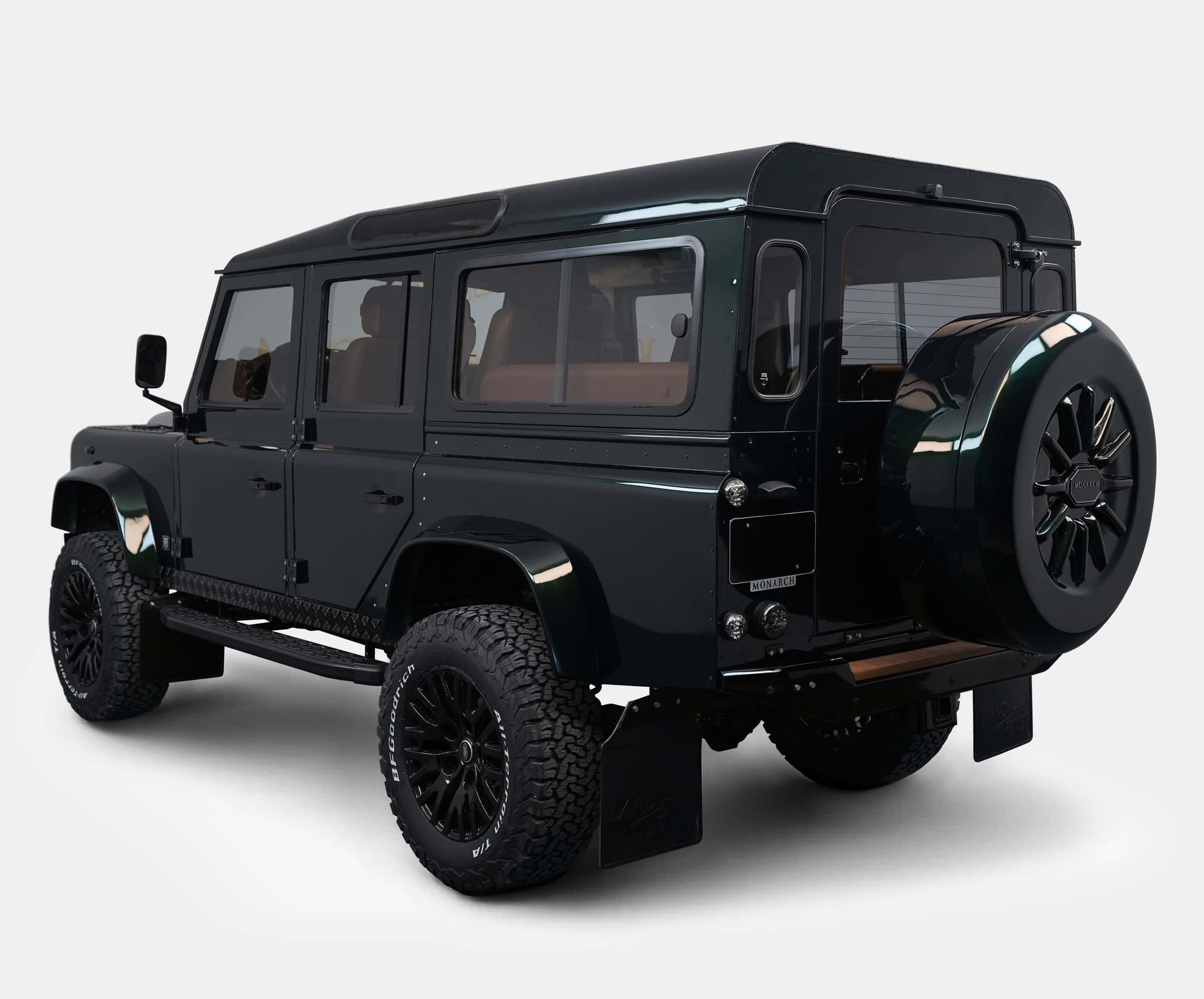 Custom Land Rover Defender in dark green finish with off-road tires
