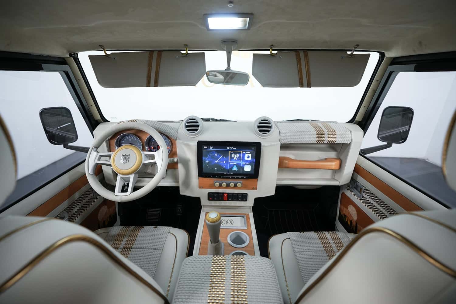 Luxurious interior of a custom Land Rover Defender featuring premium materials and modern technology