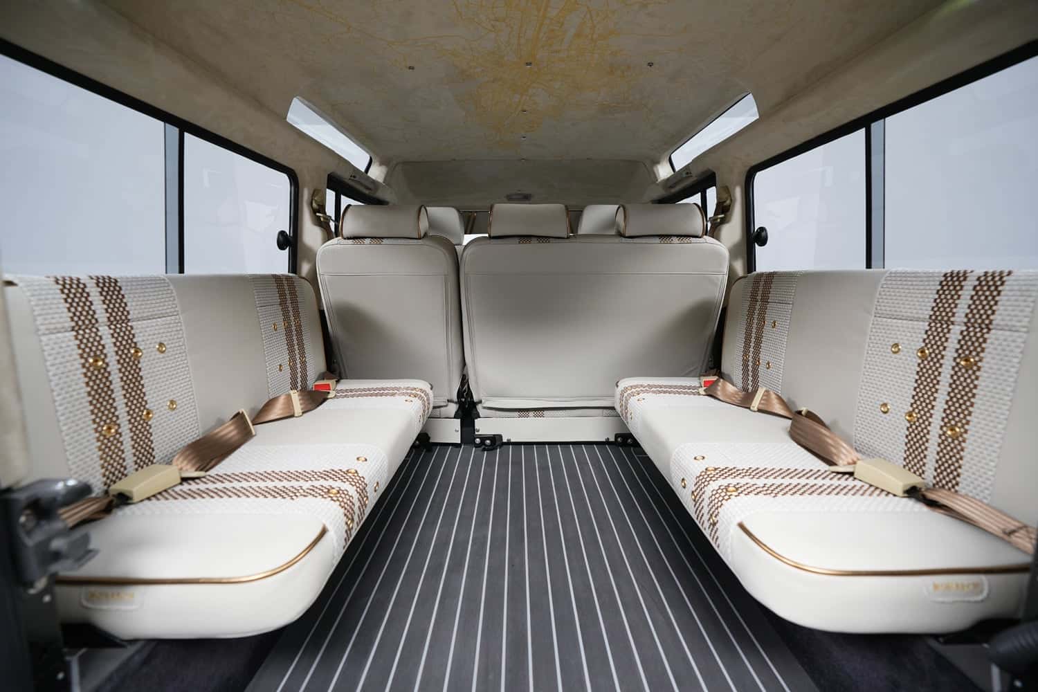 Interior of a bespoke Land Rover Defender showcasing luxury seating and design details