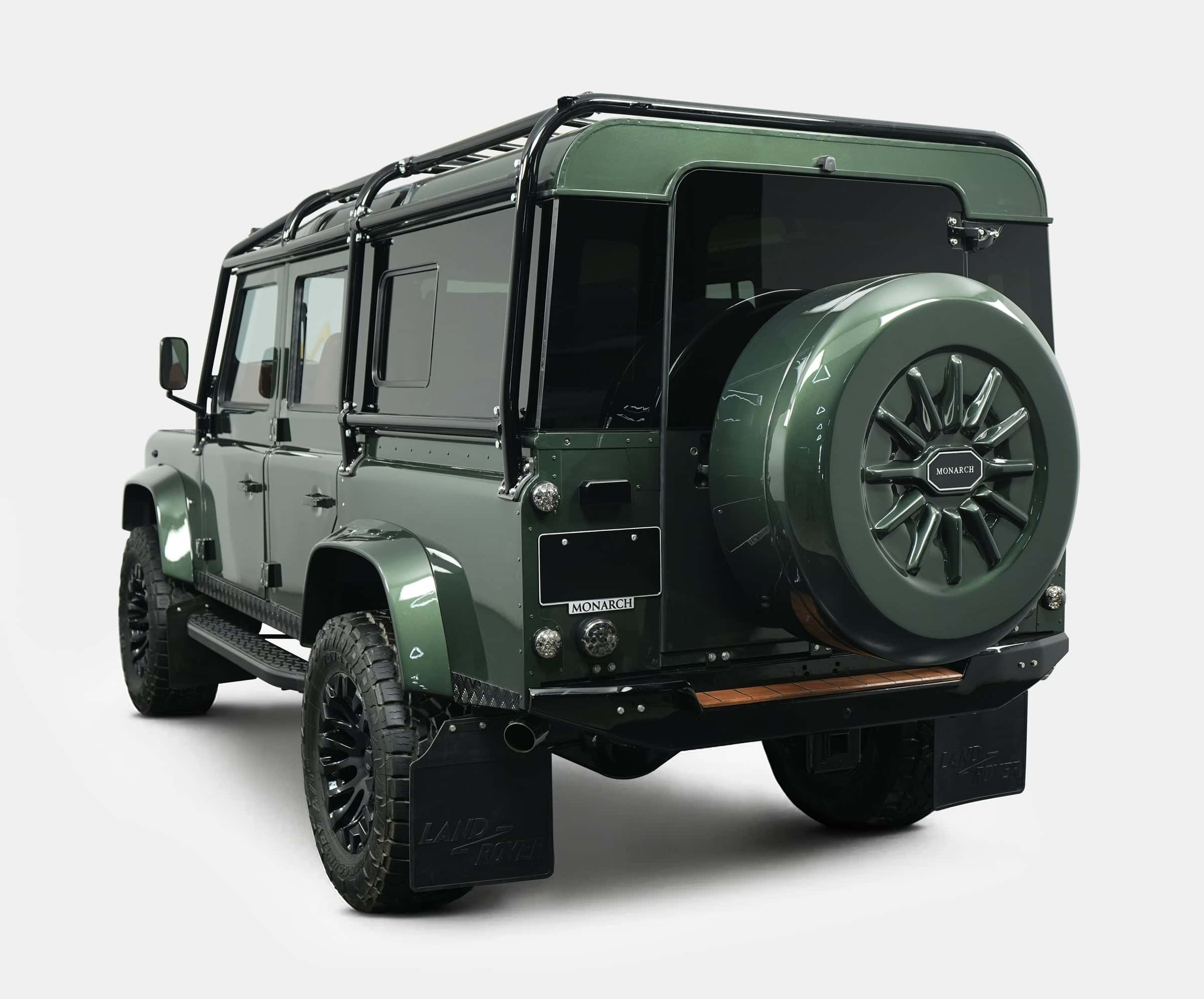 Rear view of a bespoke Land Rover Defender in deep green with custom features