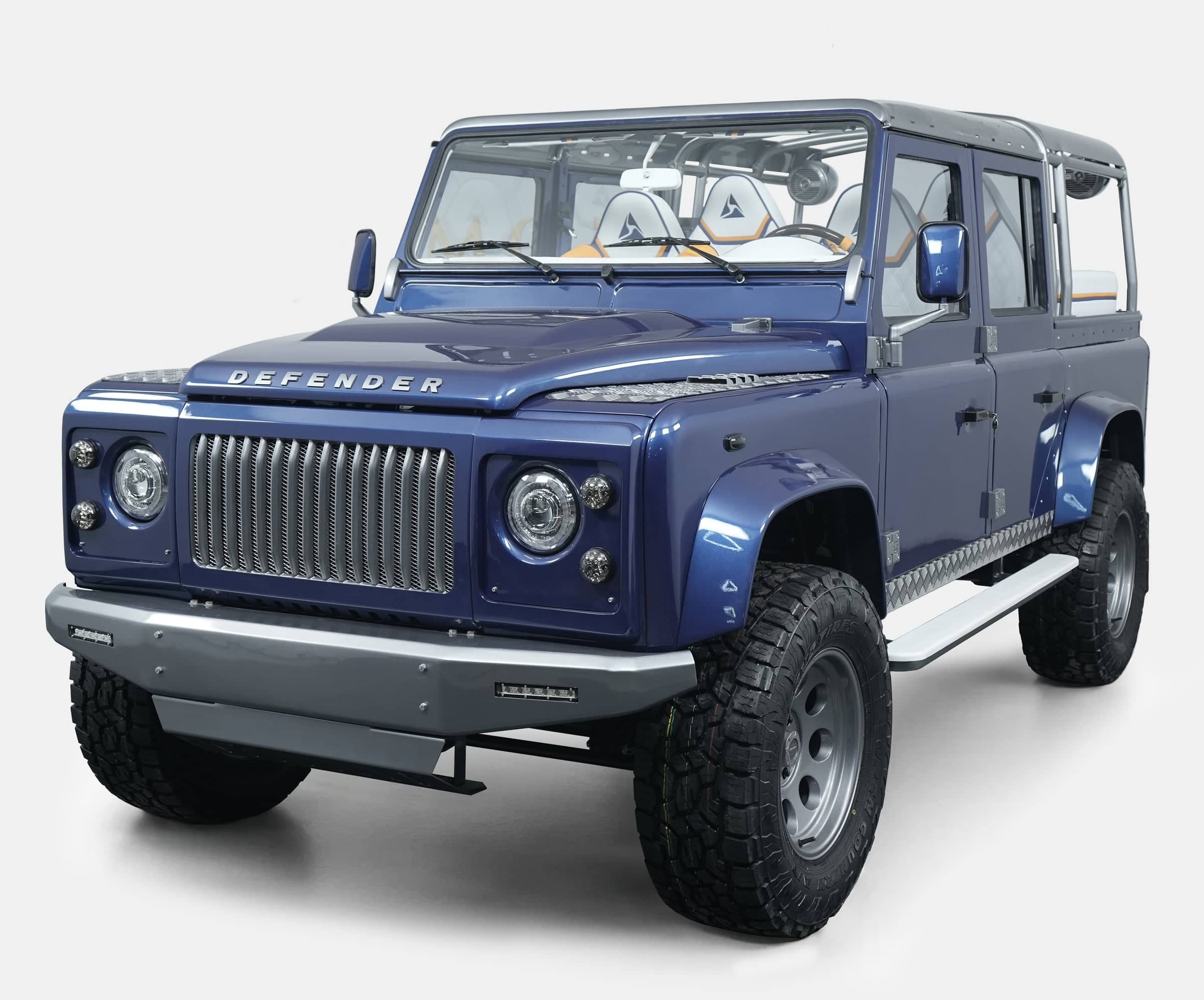 Bespoke Land Rover Defender in blue with unique grille and off-road tires