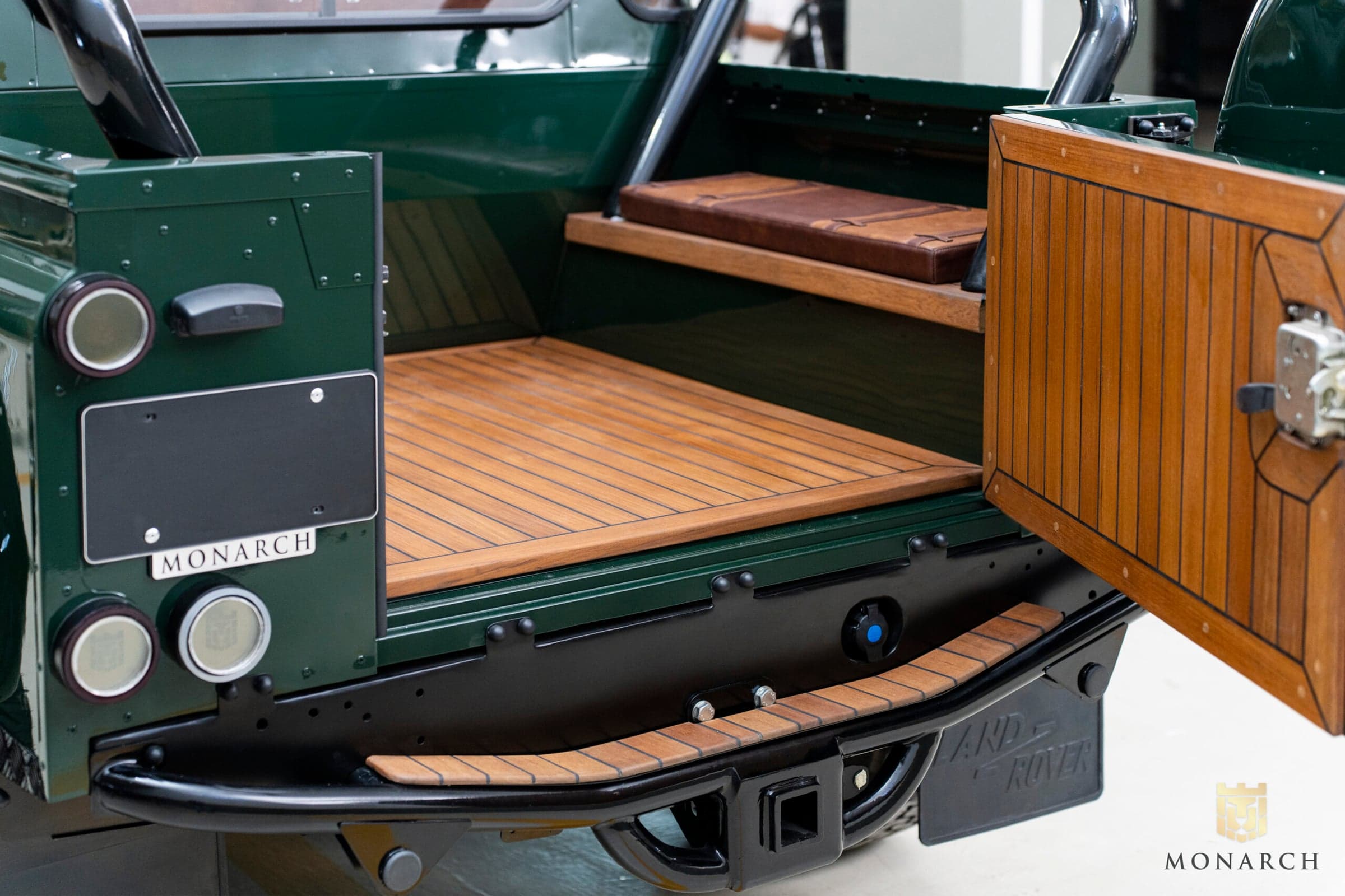 Luxury Land Rover Defender cargo area with wooden flooring and custom features