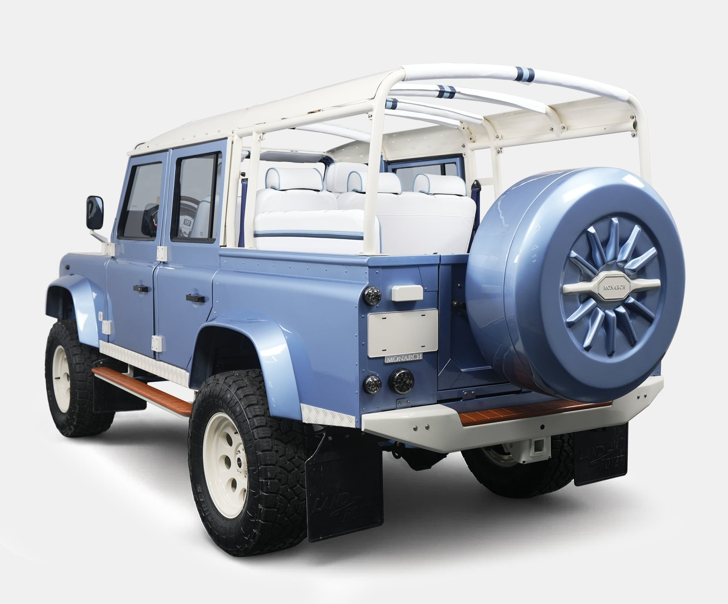Custom Land Rover Defender in light blue with premium white interior and rugged tires