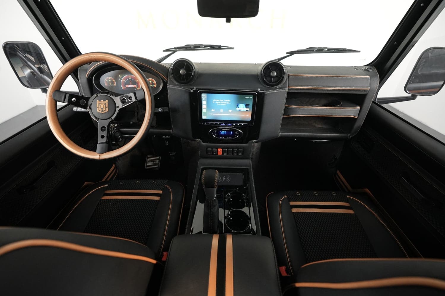 Bespoke Land Rover Defender interior showcasing premium materials and modern technology