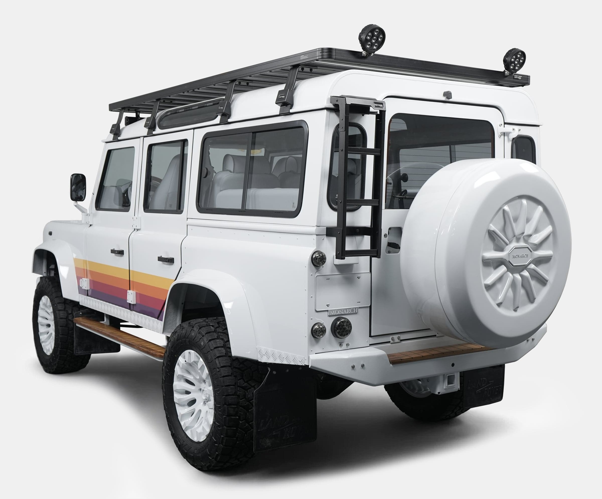 Custom Land Rover Defender with distinctive rear styling and roof rack