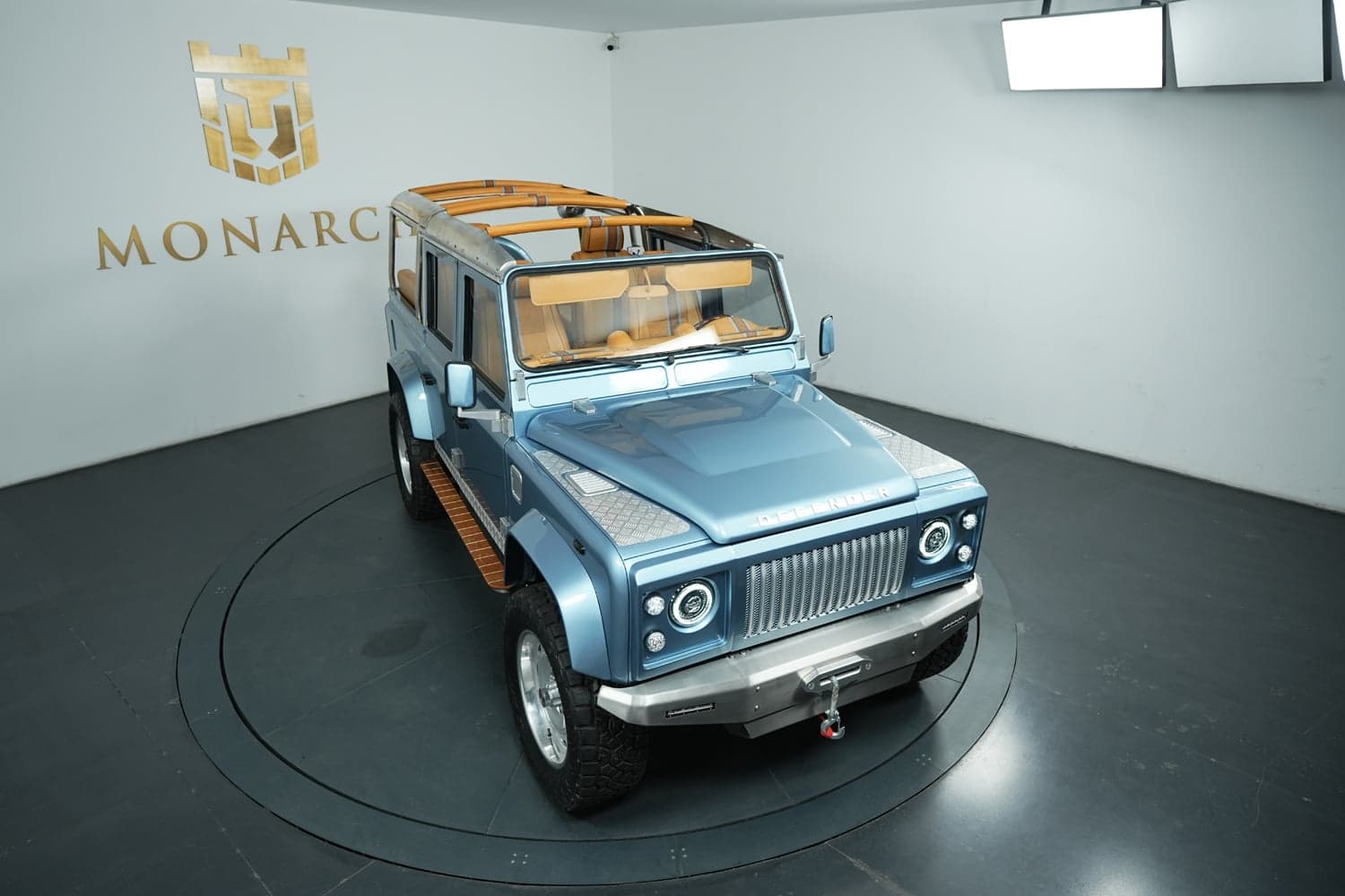 Bespoke leather interior of a custom Monarch Defender showing hand-stitched seats and trimmed dashboard