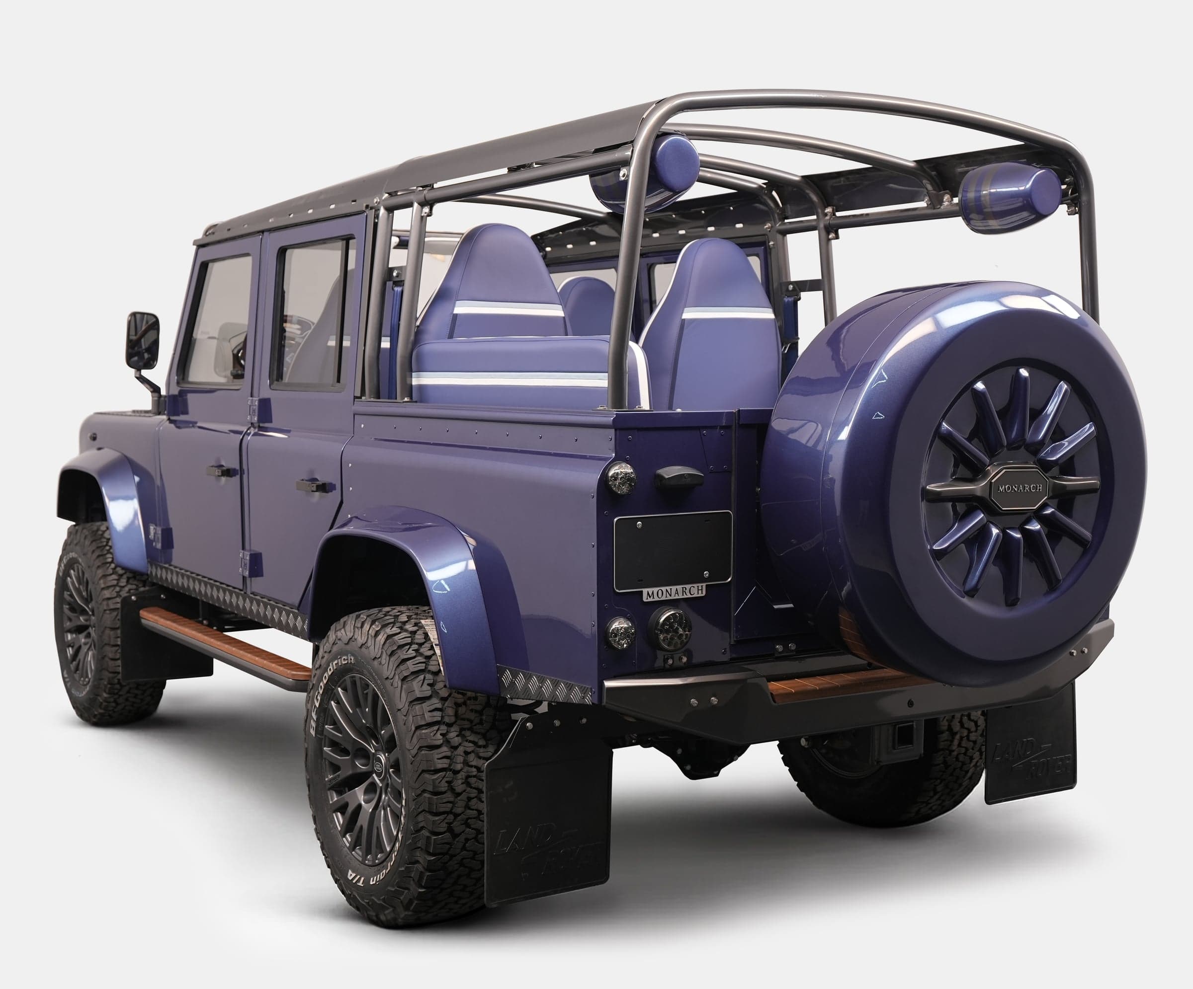 Bespoke Land Rover Defender in deep blue with custom seating and off-road tires