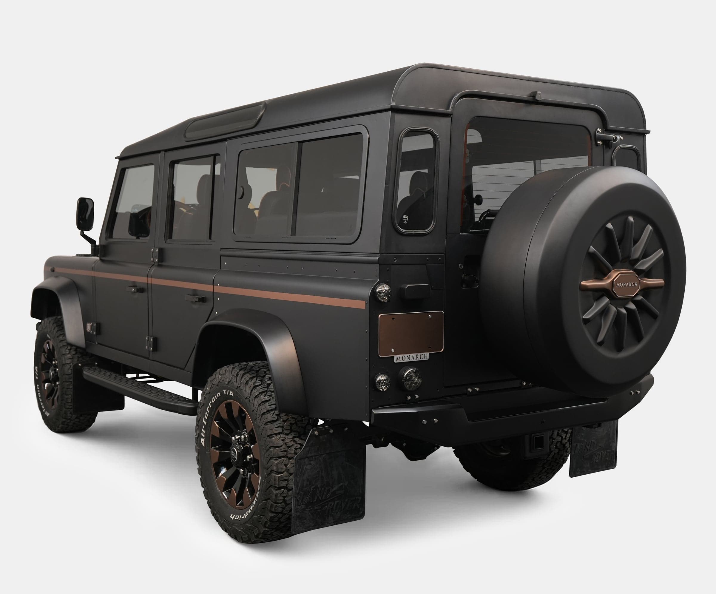 Rear view of a bespoke Land Rover Defender with a matte finish and stylish accents