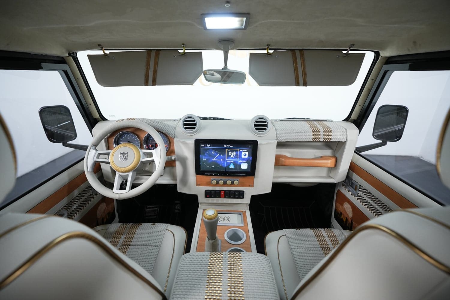 Luxurious interior of a custom Land Rover Defender featuring premium materials and modern technology
