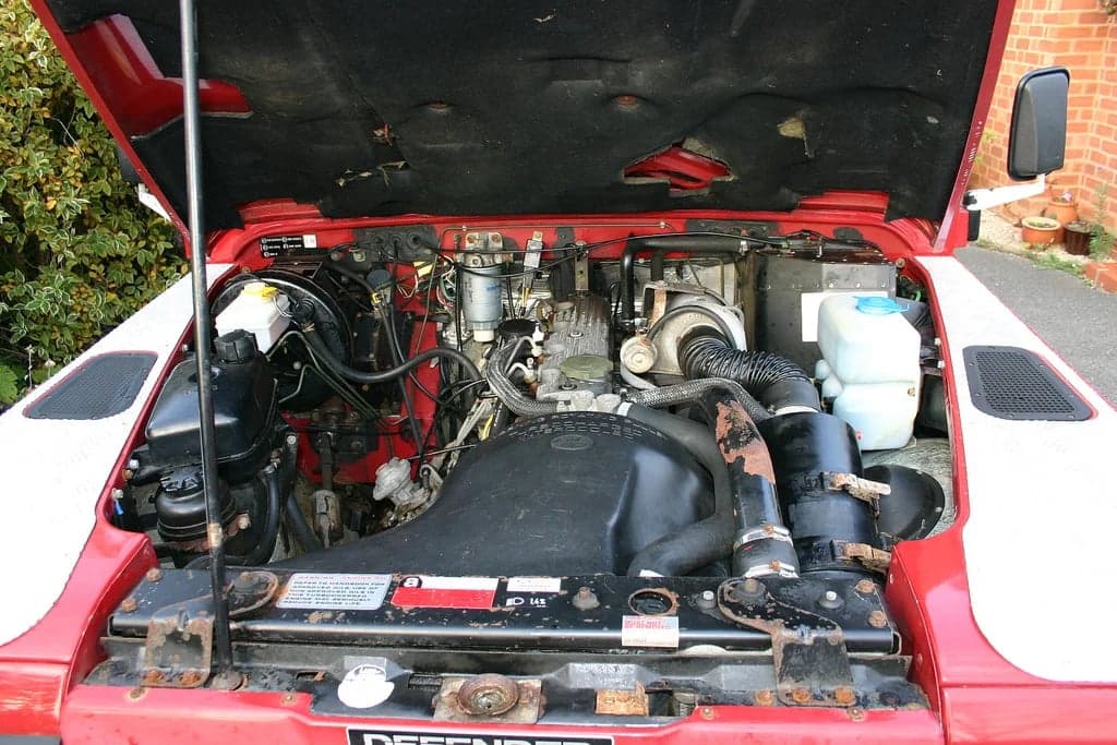 Close-up of a 200Tdi engine bay in a 1990 Defender, showing the top-mounted turbocharger configuration unique to the Defender variant