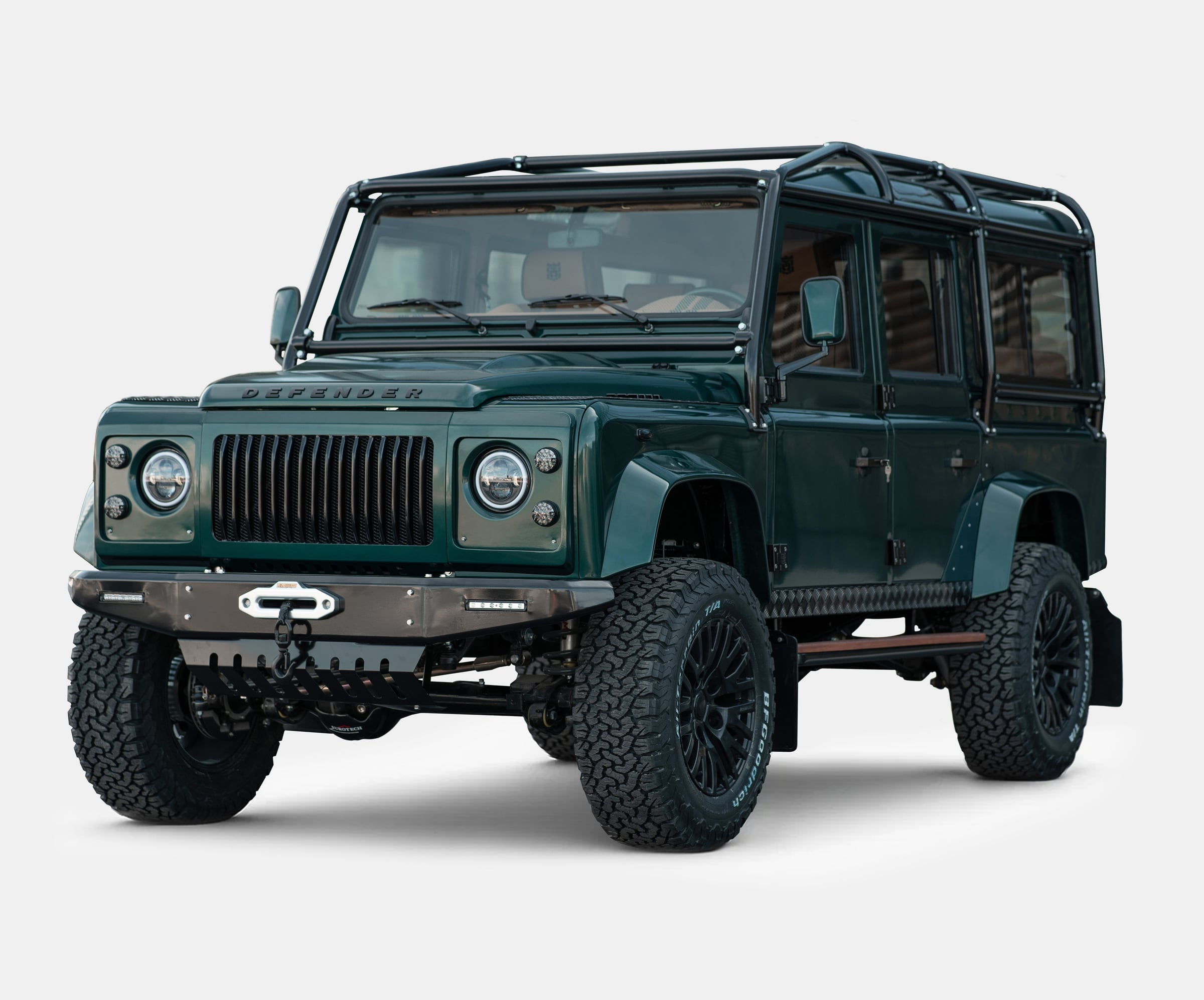 Bespoke Land Rover Defender in green with rugged tires