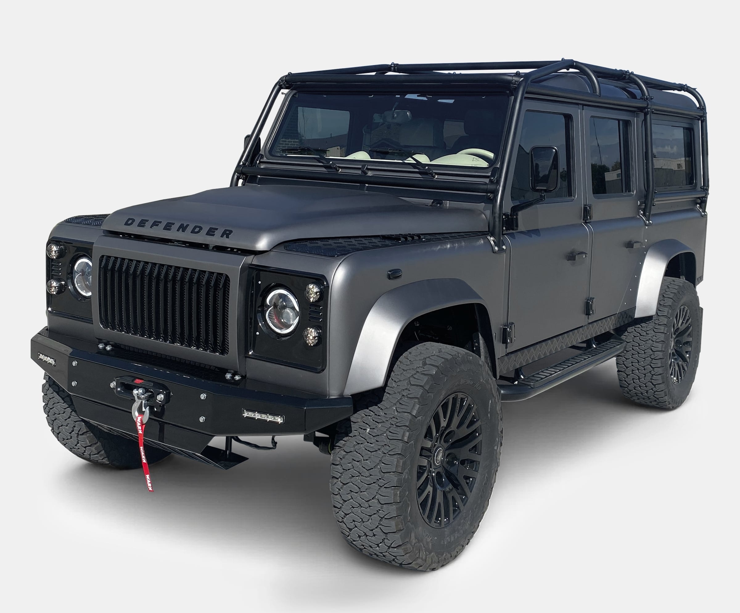 Custom Land Rover Defender with matte finish and rugged tires