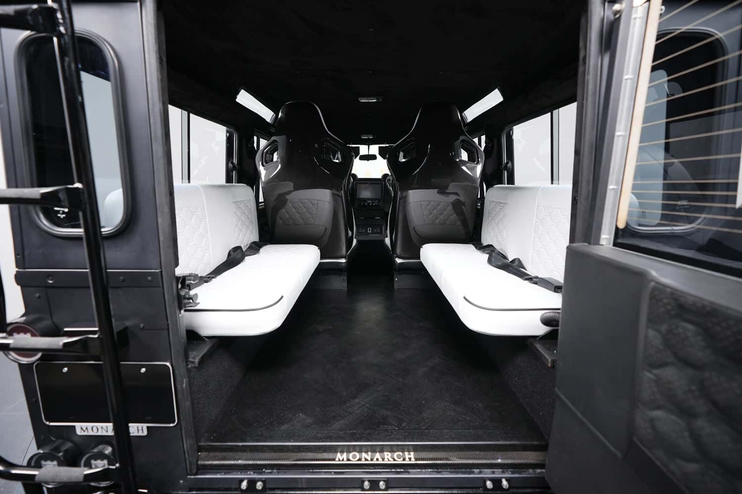 Interior Shot: Luxury Seating Interior of a custom Land Rover Defender with luxury seating