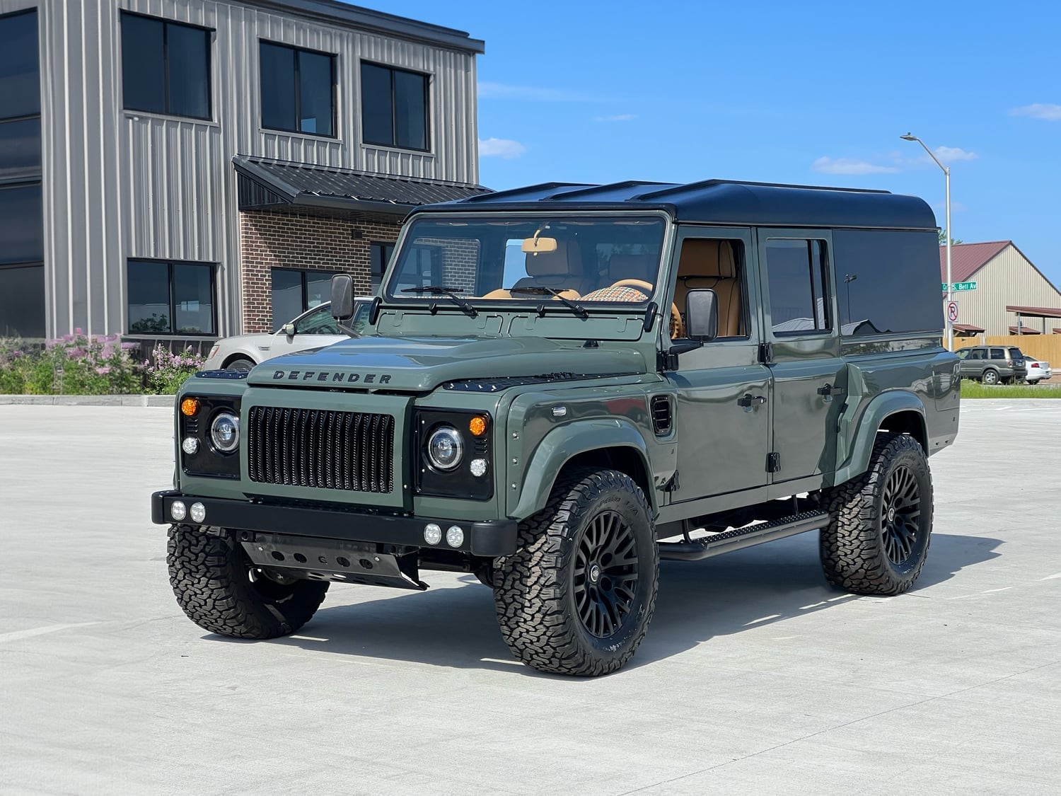 Front View: Bespoke Land Rover Defender Custom Land Rover Defender in green with luxury interior