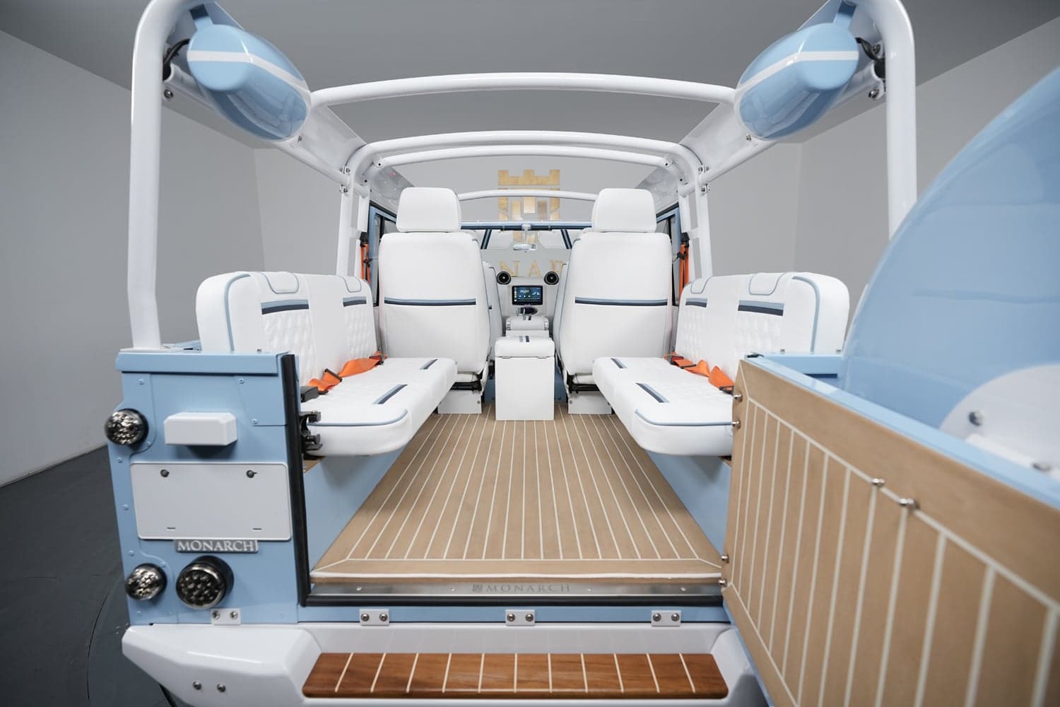 Interior Shot: Bespoke Land Rover Defender Interior view showcasing a custom Land Rover Defender with luxurious white seats and blue accents.