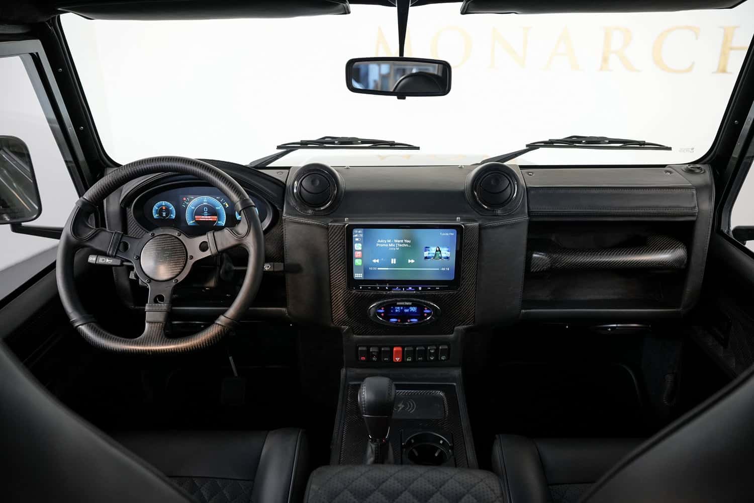 Interior Shot: Luxury Cabin Custom Land Rover Defender interior featuring a modern dashboard and premium materials
