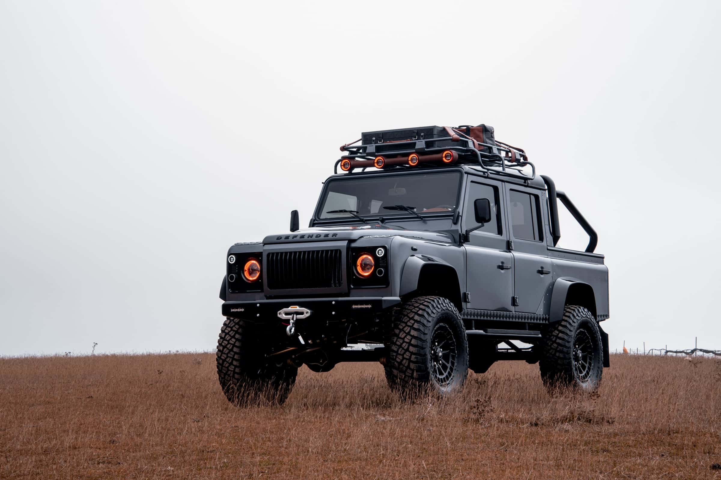 Action Shot: Custom Land Rover Defender Bespoke Land Rover Defender in a rugged outdoor setting