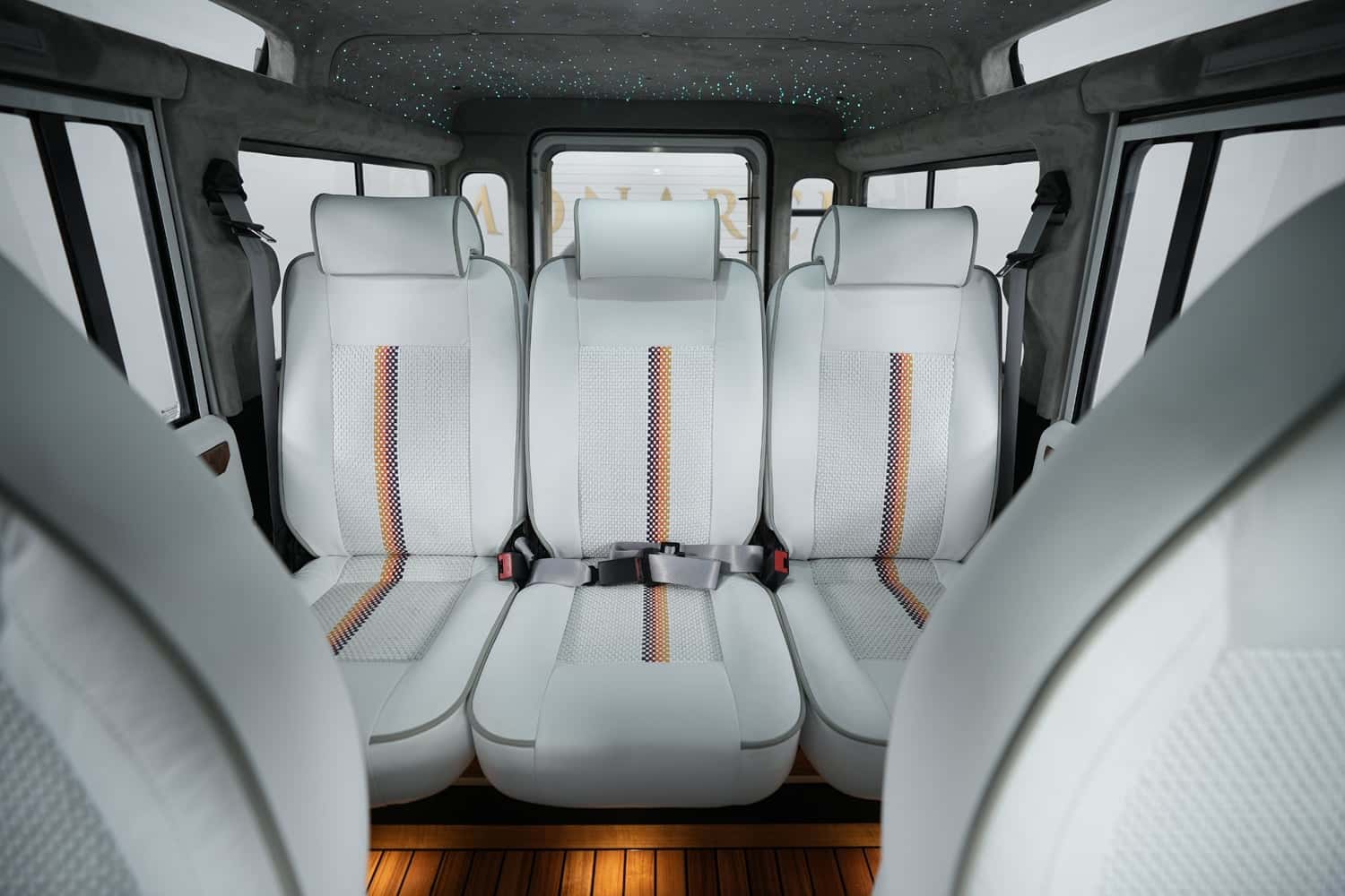 Interior Shot: Luxury Seating Custom Land Rover Defender interior featuring luxury white leather seats with intricate detailing